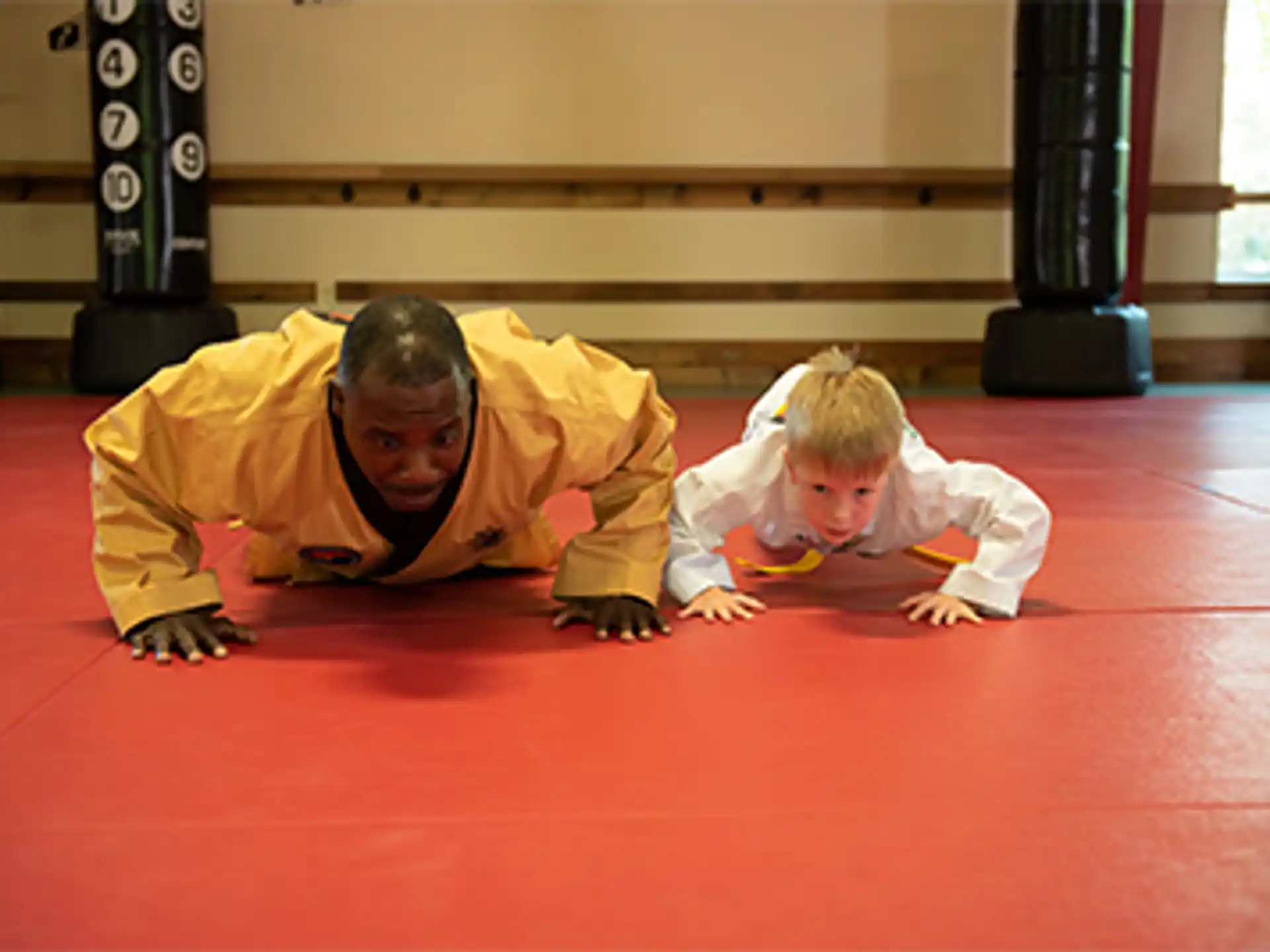 a person and a child lying on the floor