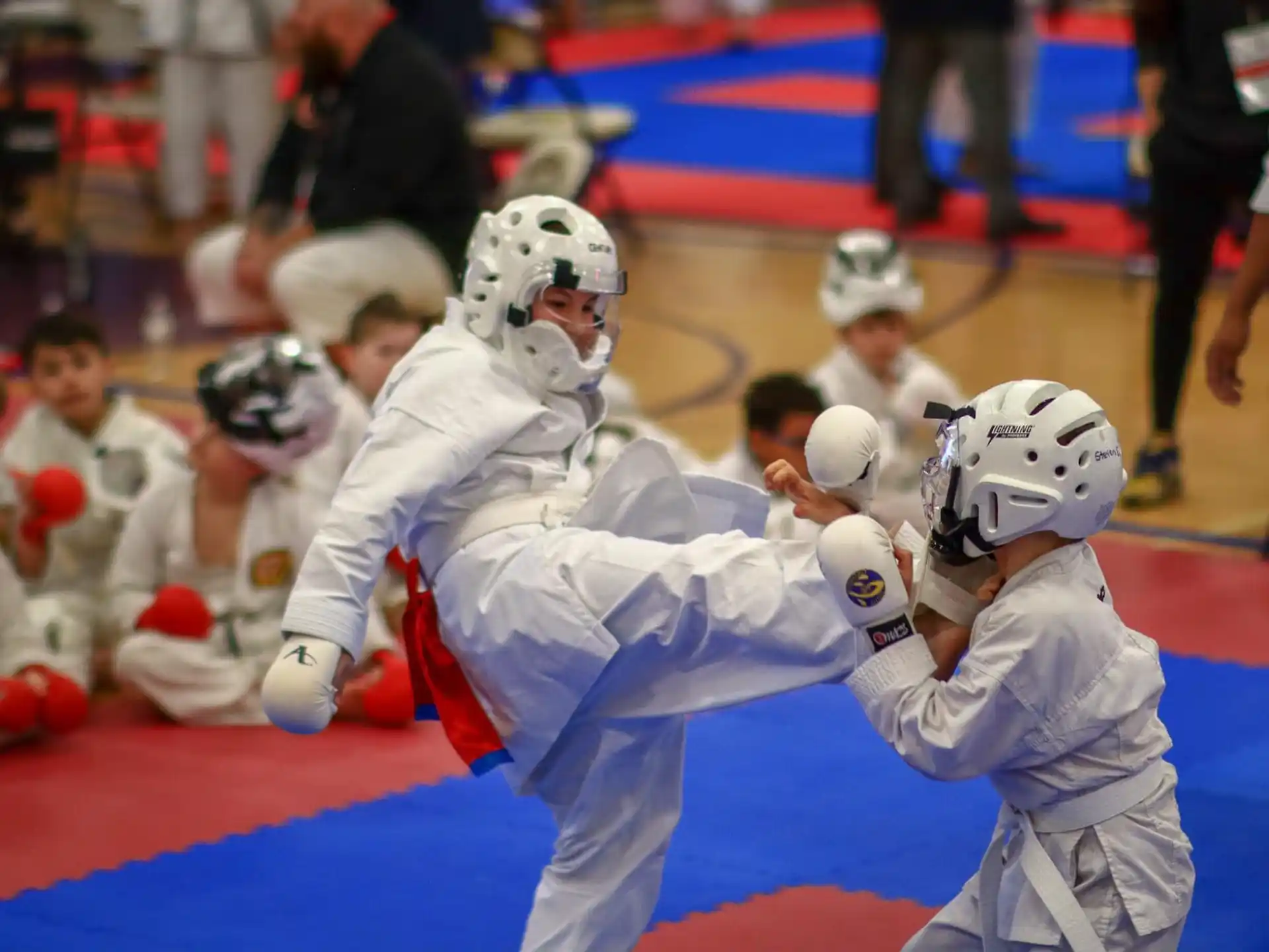 a group of people in a fighting match