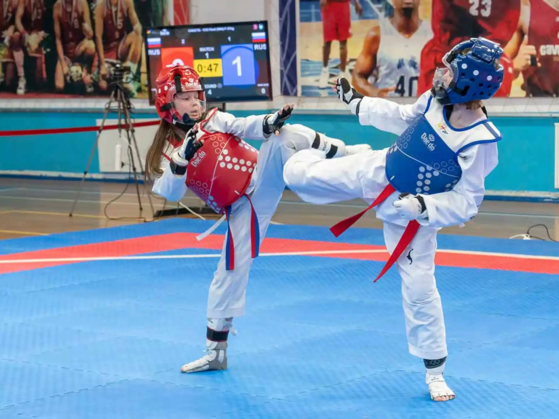 a person kicking another man in the face with a helmet
