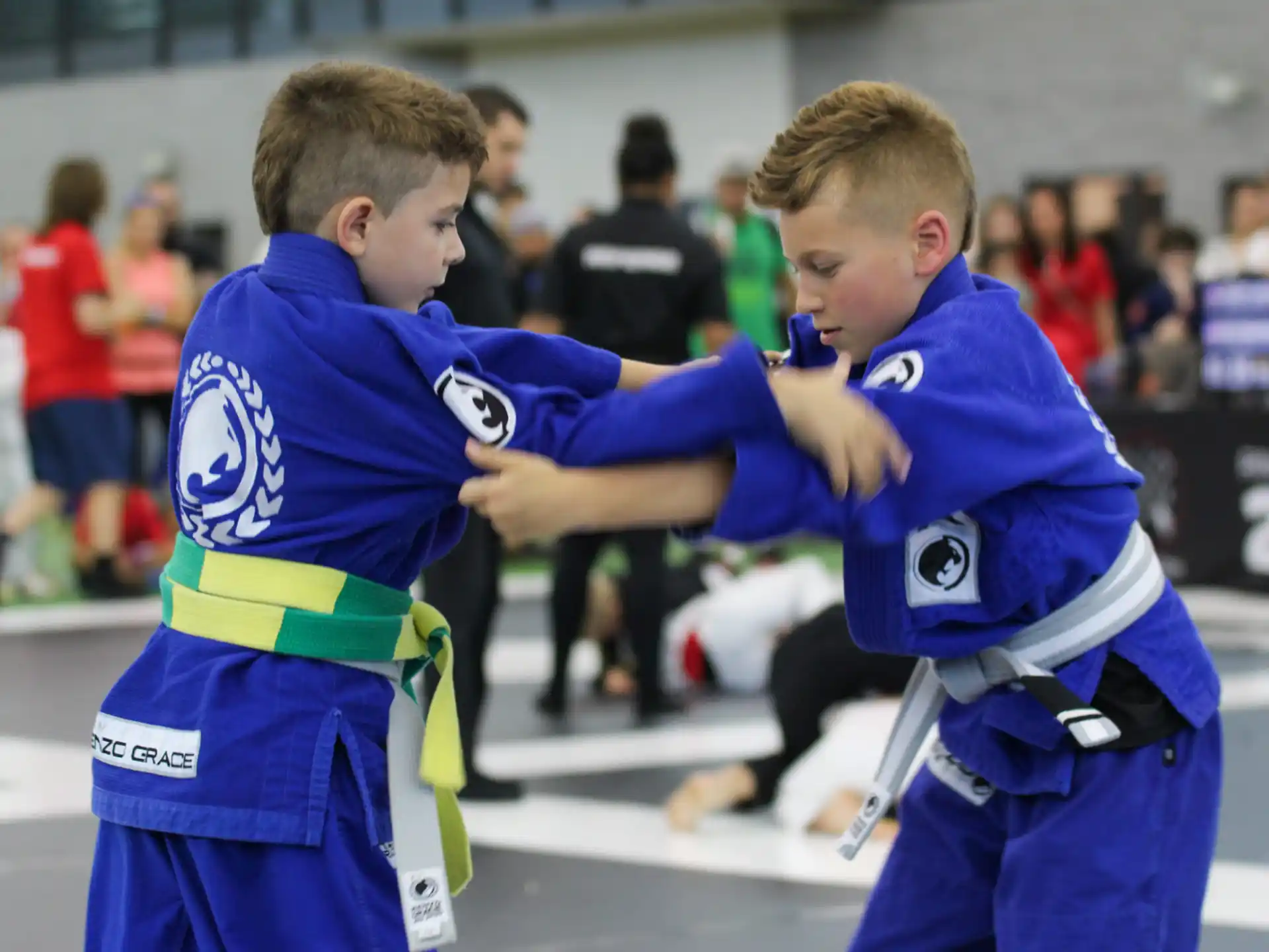 a couple of boys in blue uniforms