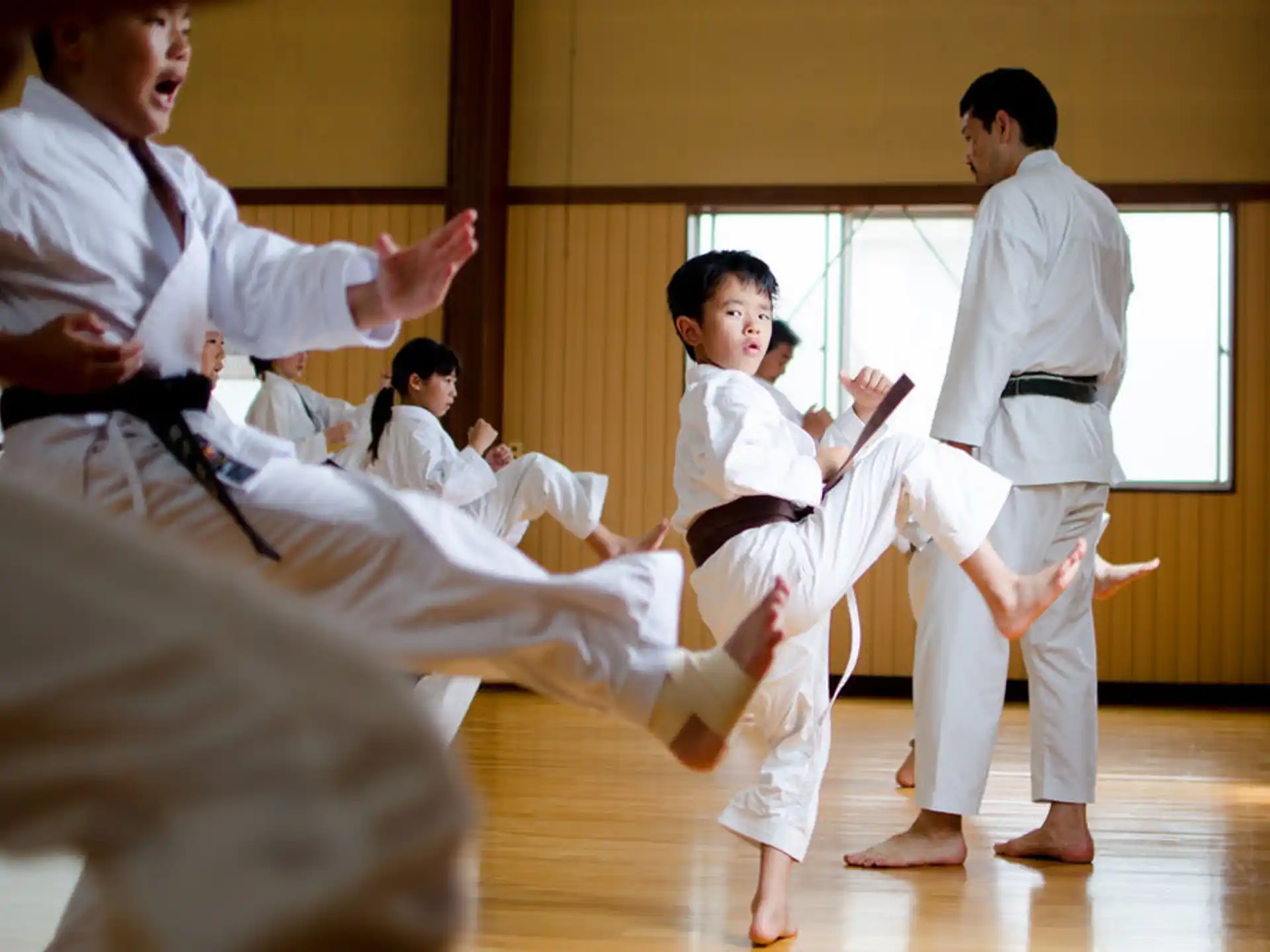 a group of people in karate uniforms