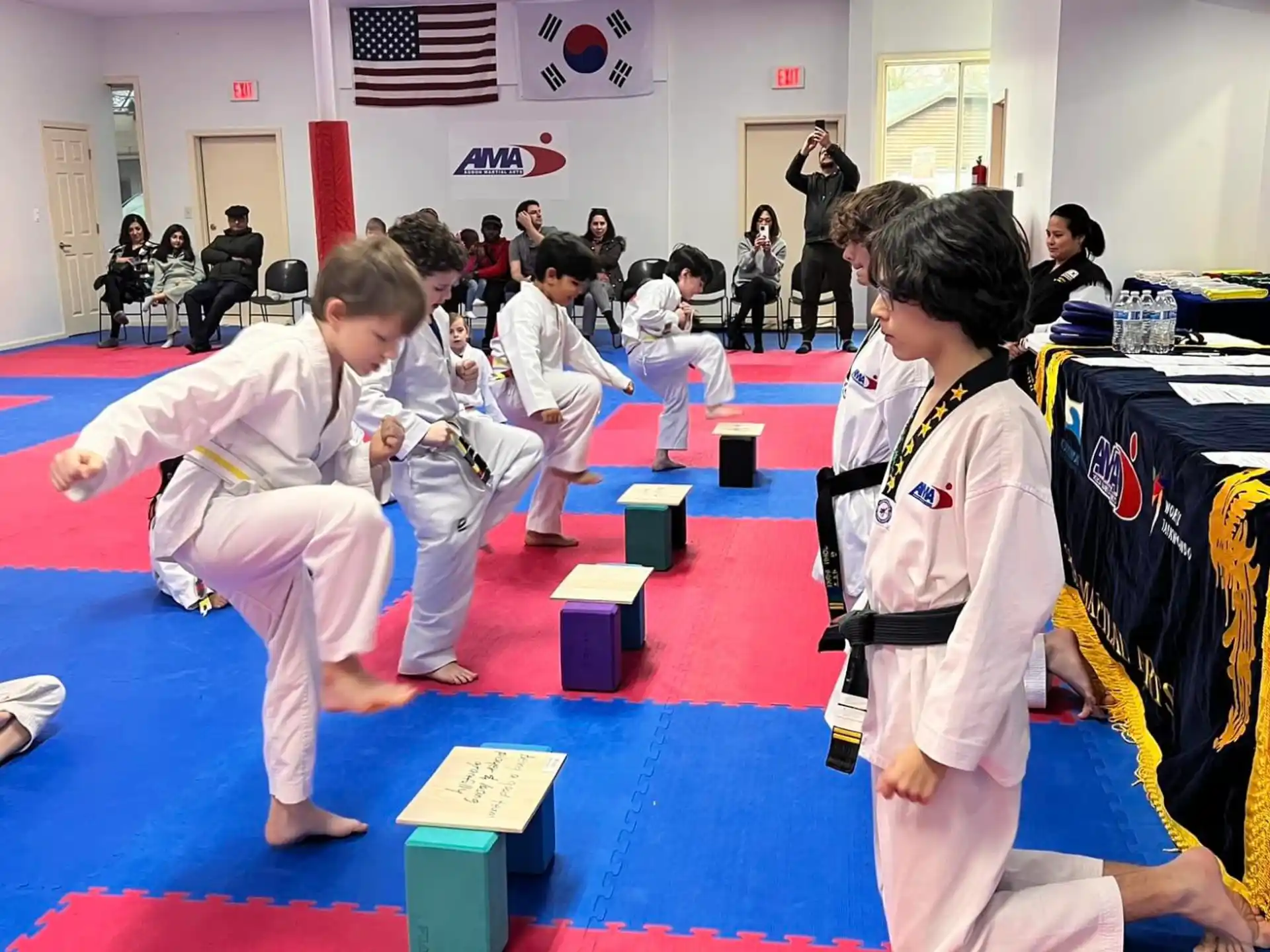 a group of children in karate uniforms