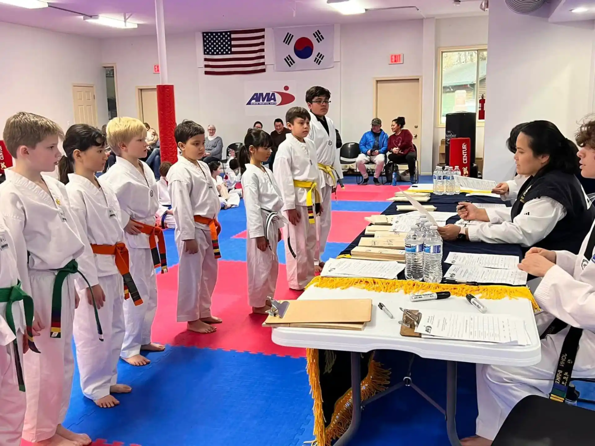 a group of people in white karate uniforms