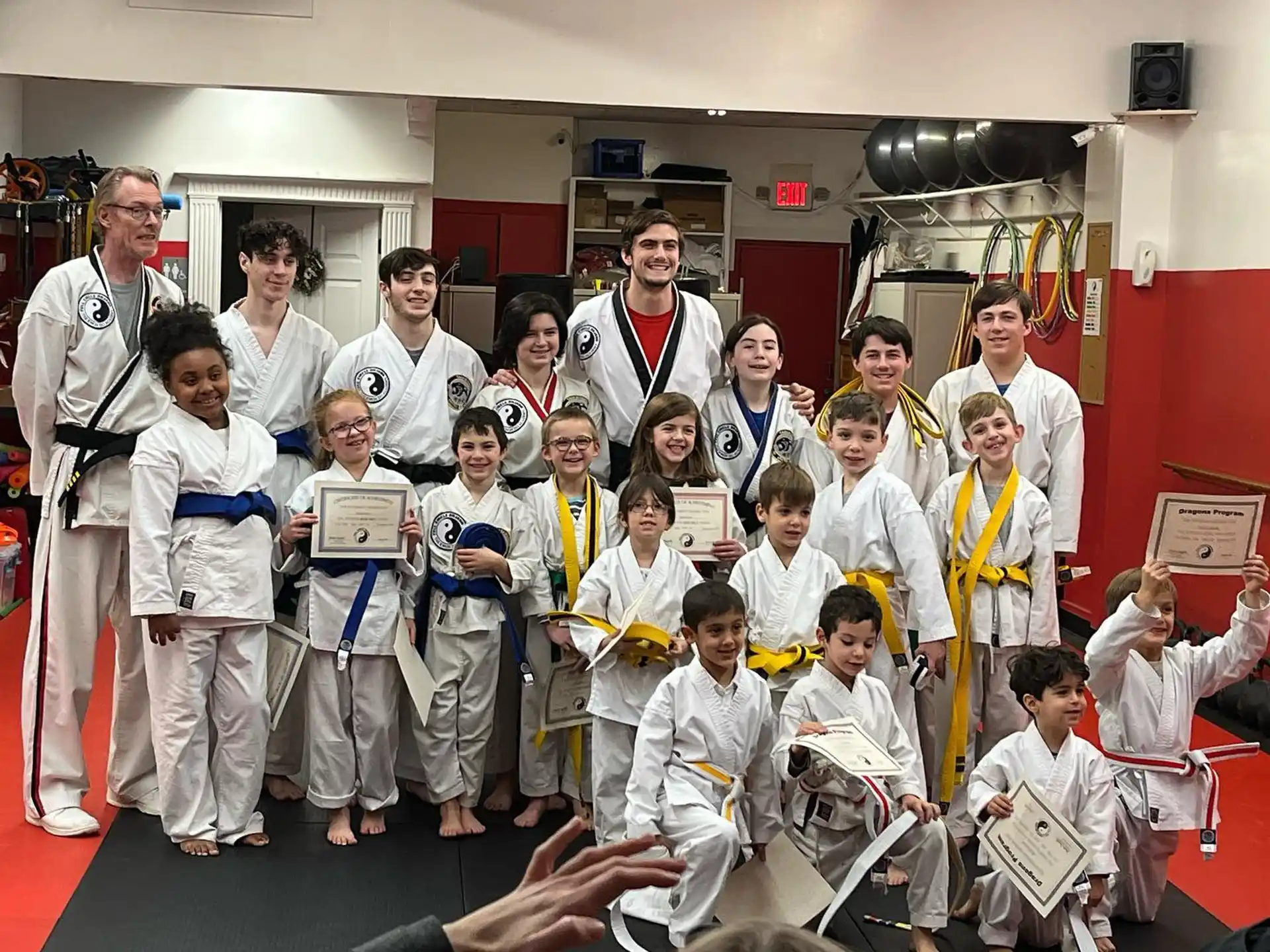 a group of people in karate uniforms