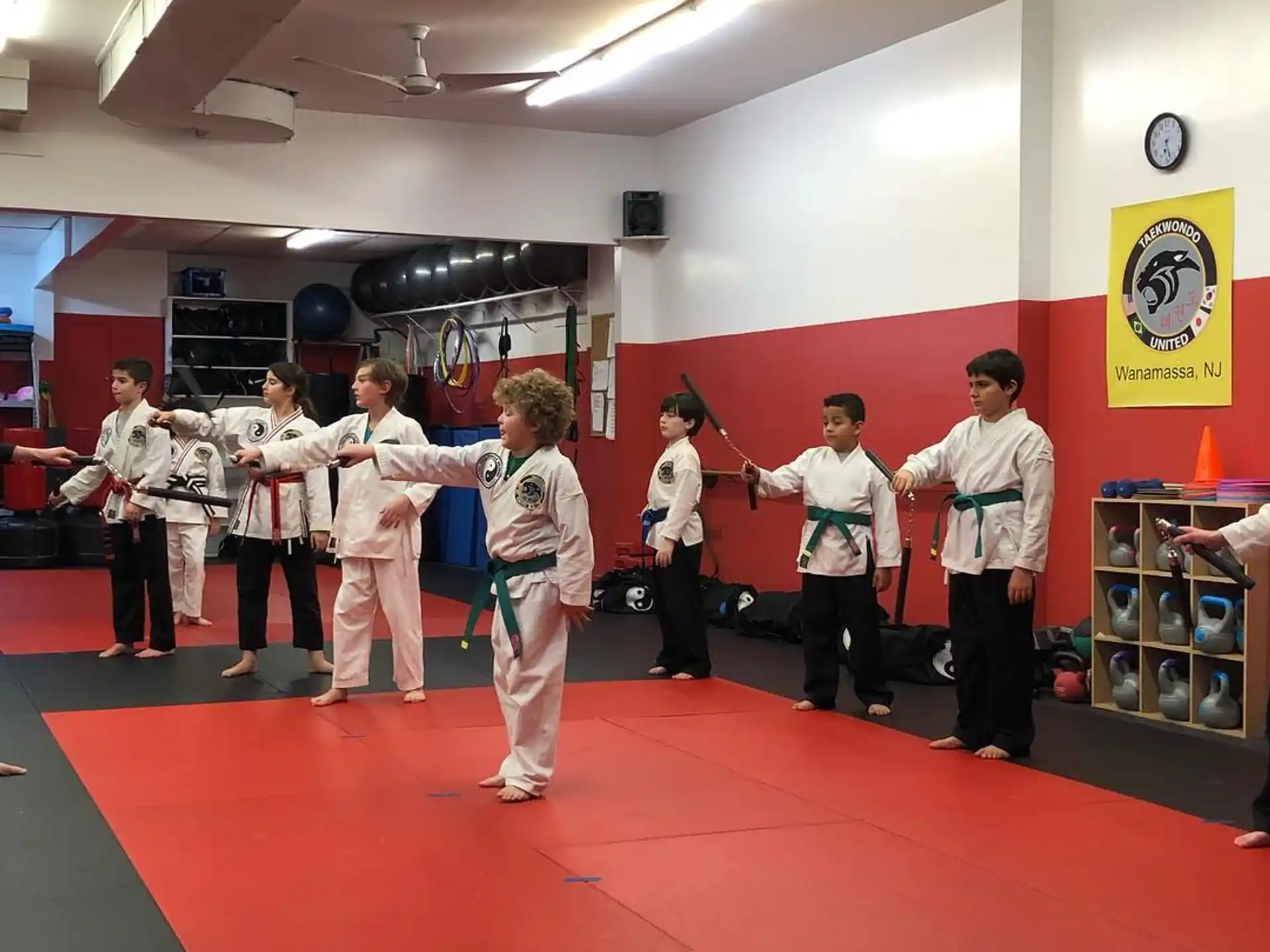 a group of people in karate uniforms