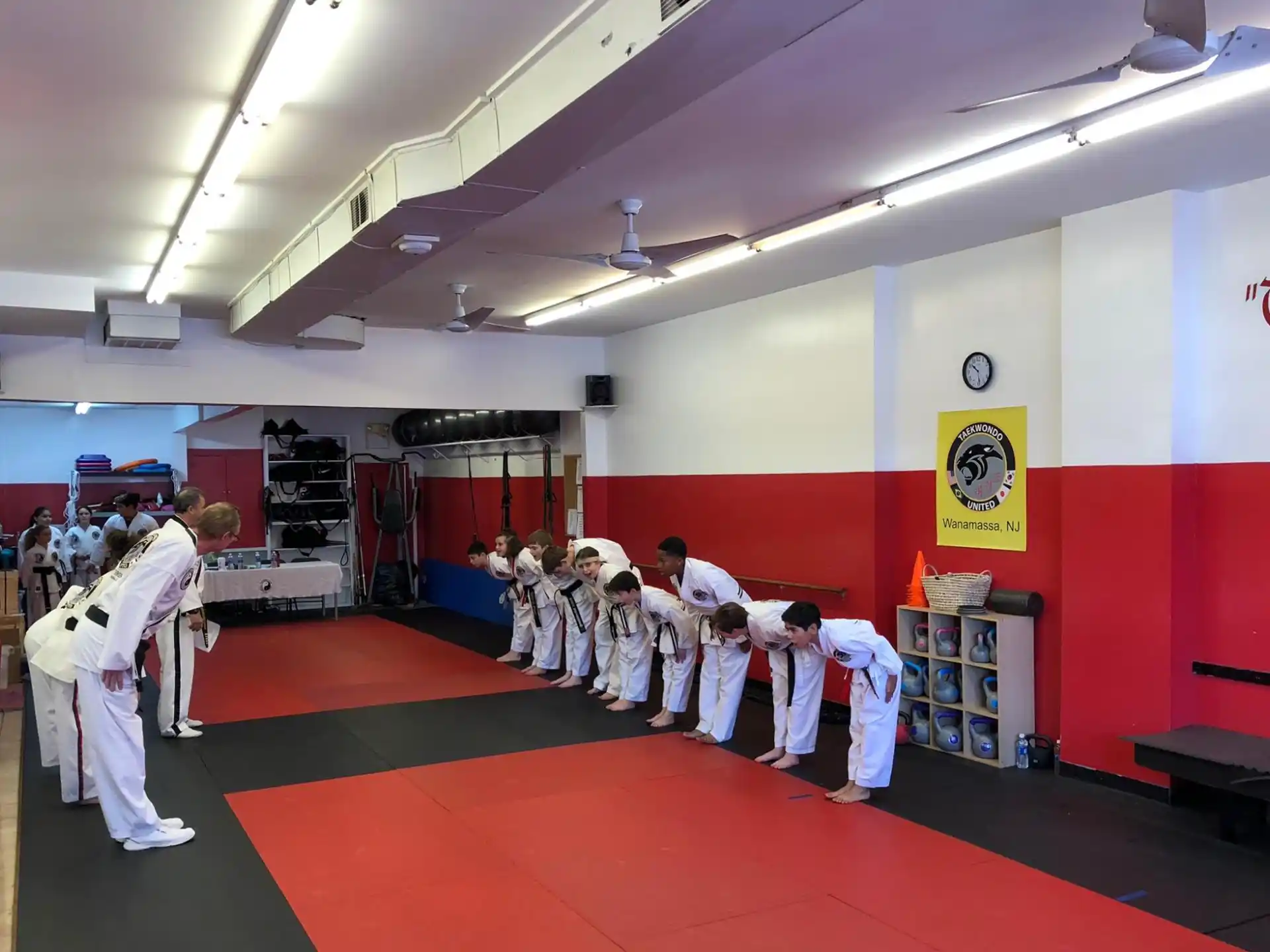 a group of people in karate uniforms