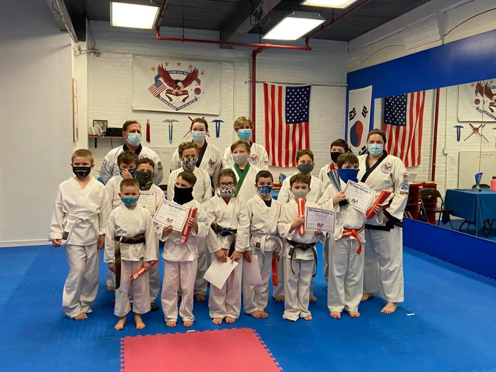 a group of people in karate uniforms