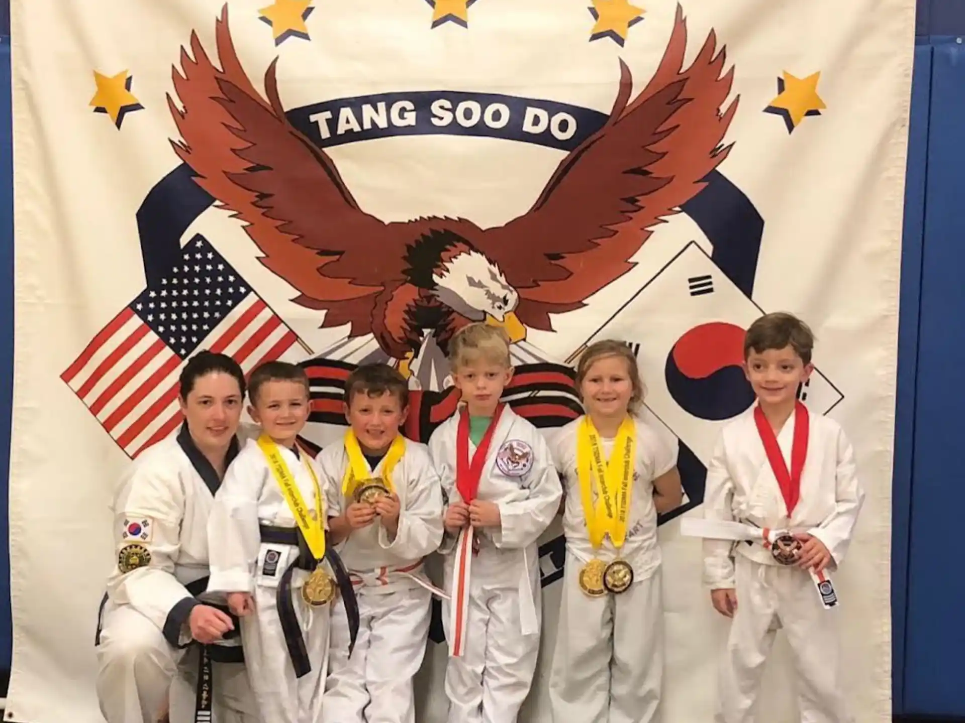 a group of people in karate uniforms
