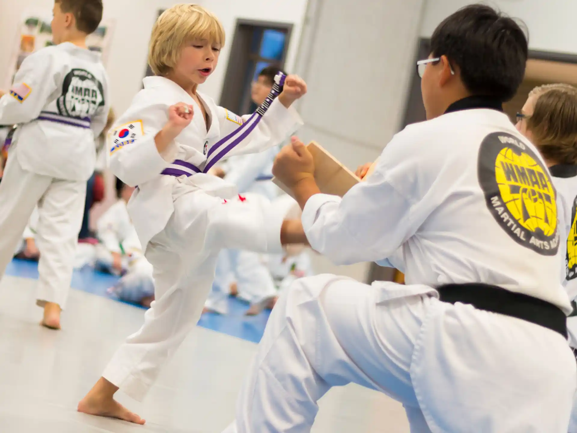 a group of people in karate uniforms