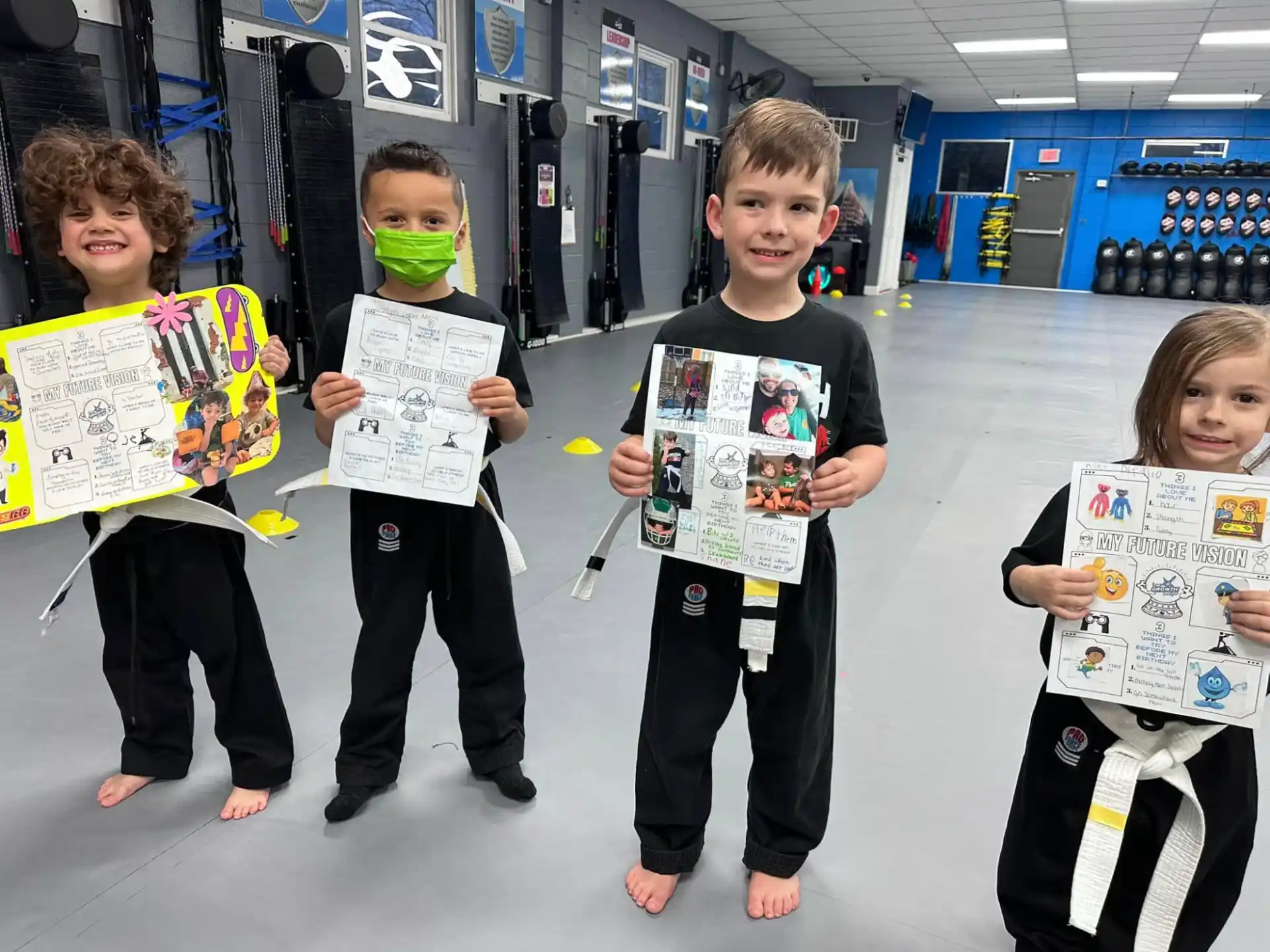 a group of children holding signs