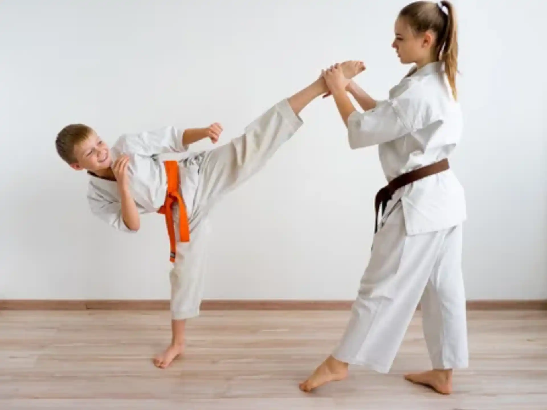 a man and a woman practicing karate