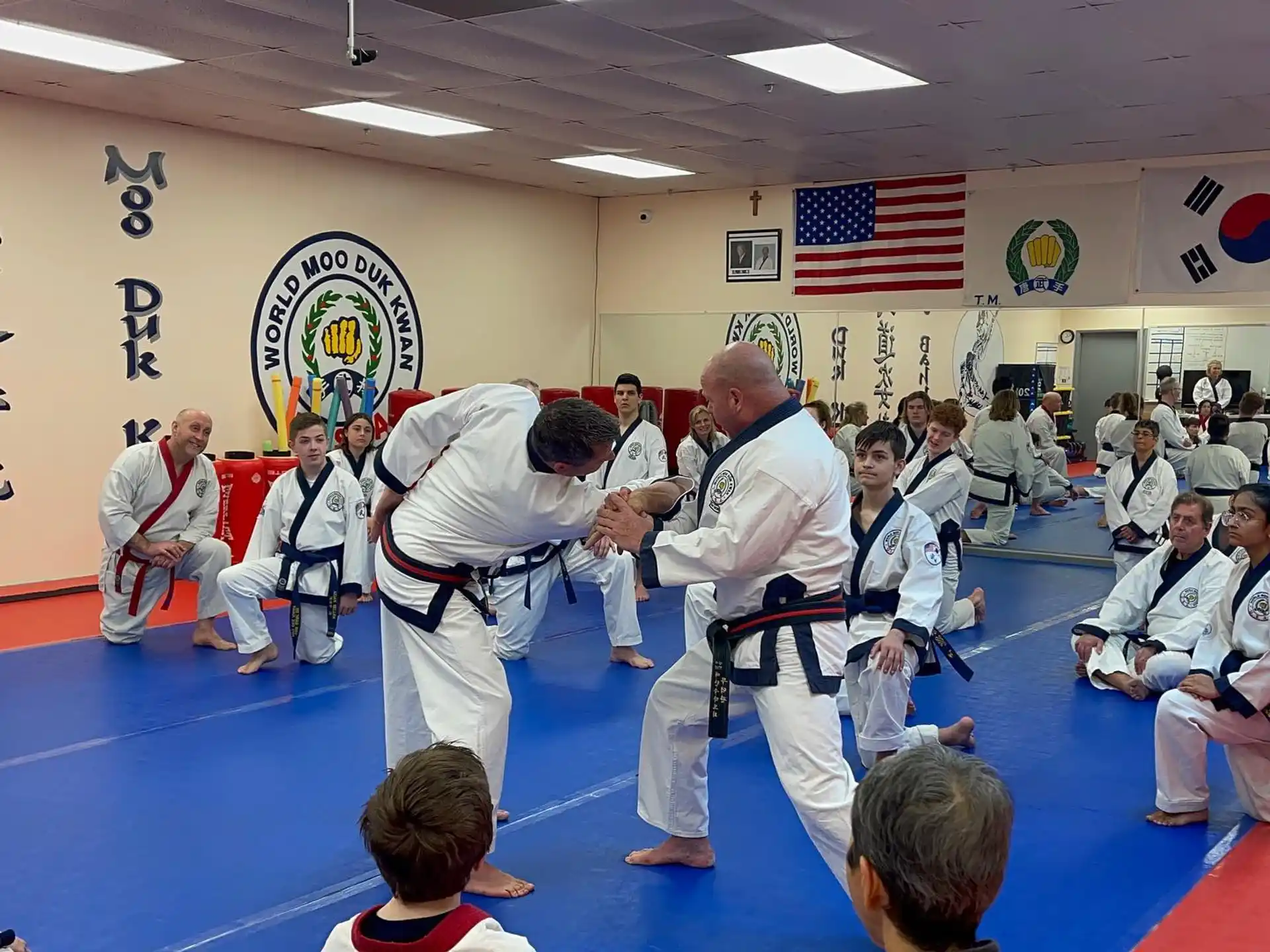 a group of people in karate uniforms