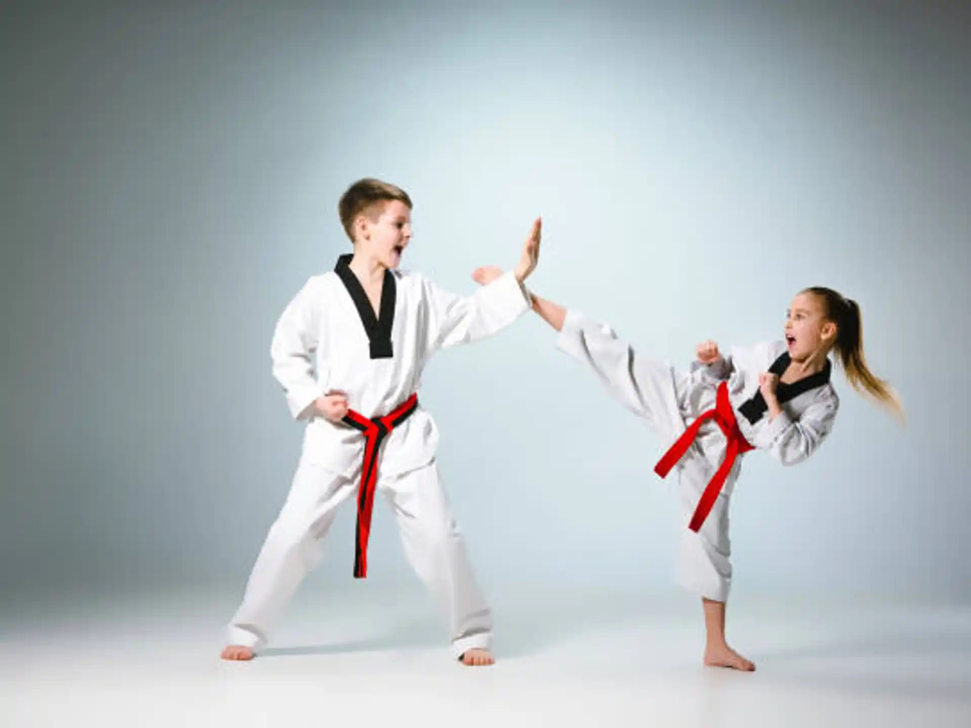 a man and a woman in karate uniforms