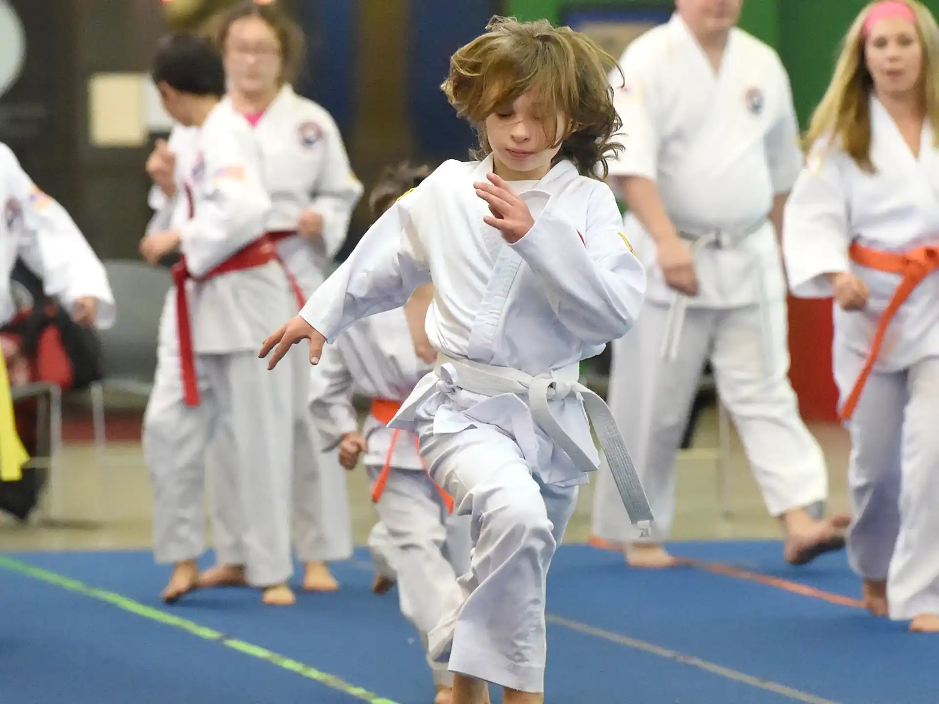 a group of people in karate uniforms