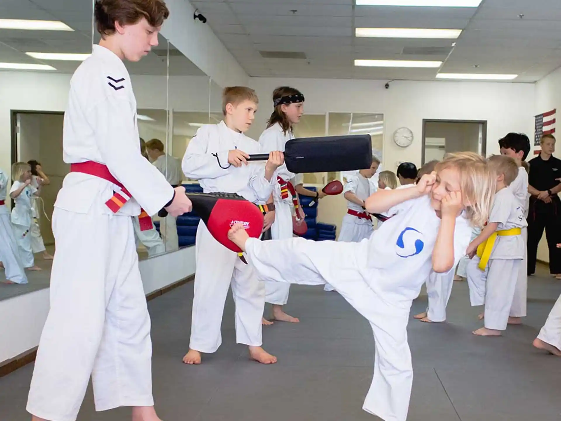 a group of people in karate uniforms