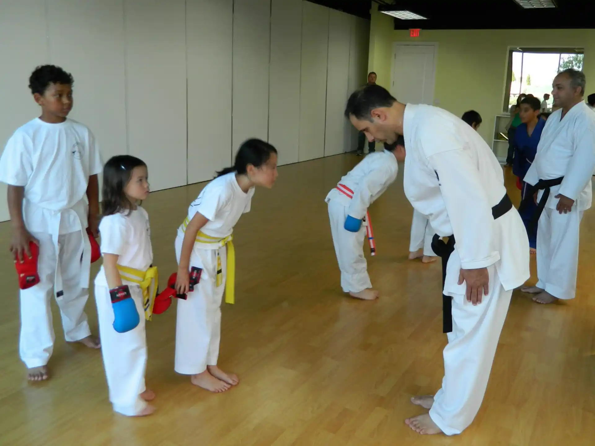 a group of people in karate uniforms
