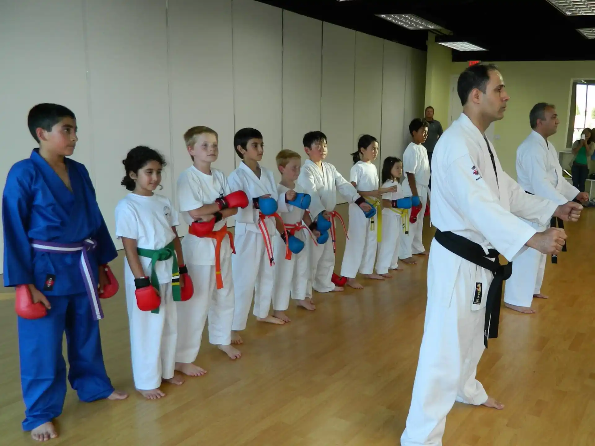 a group of people in karate uniforms