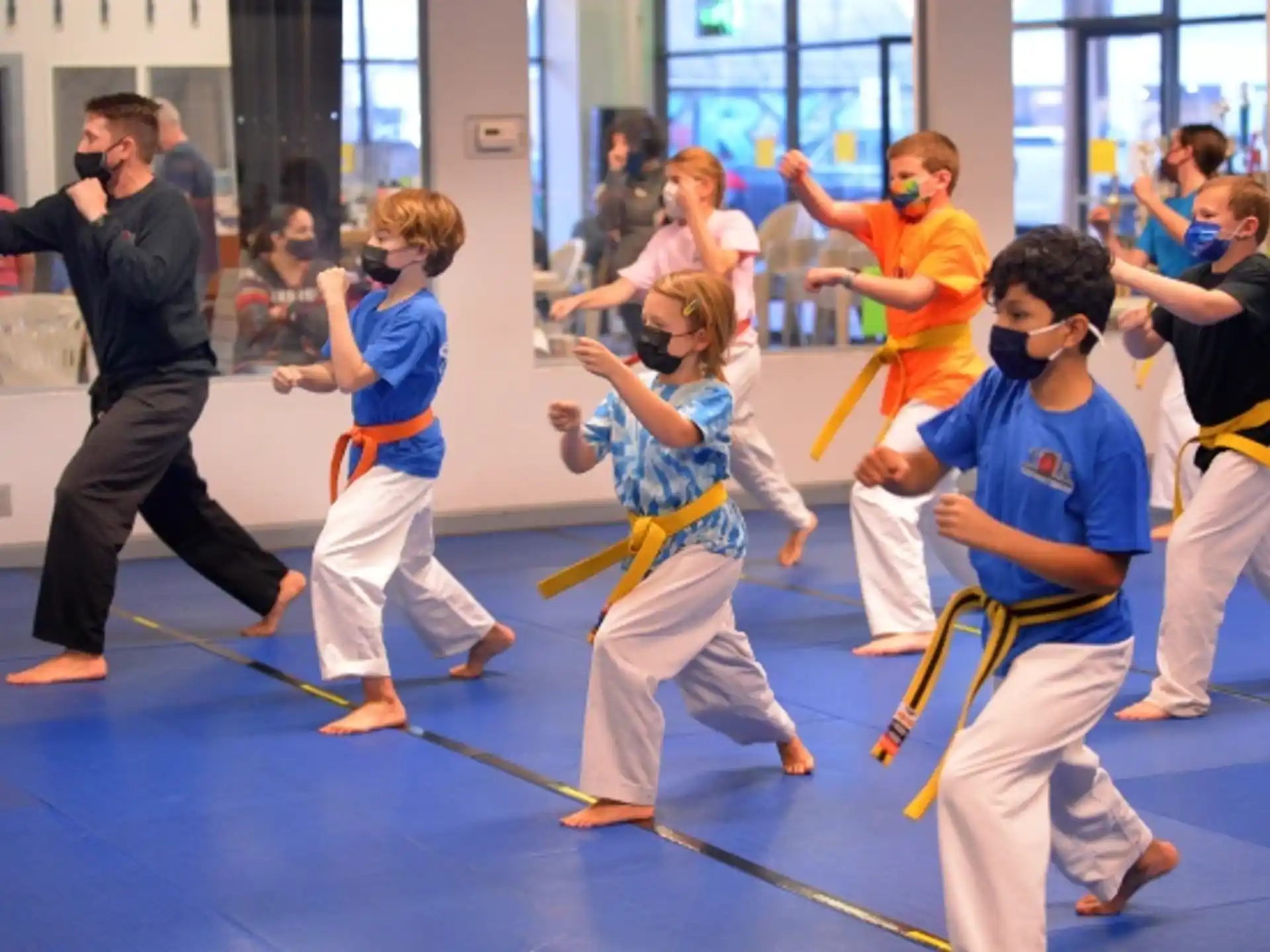 a group of people in karate uniforms