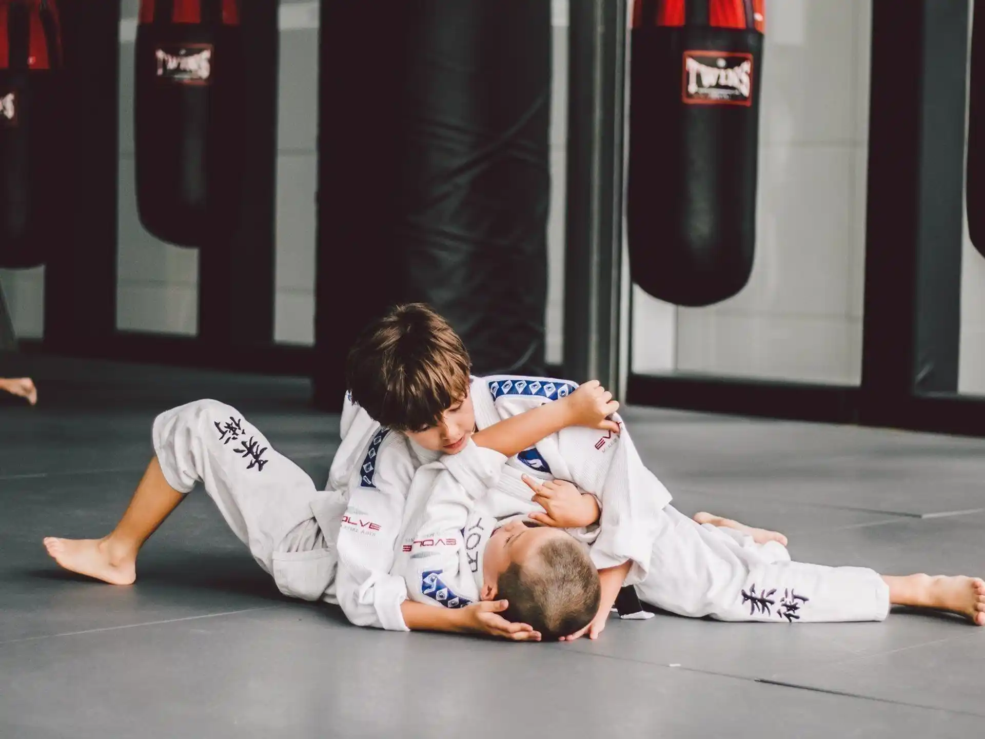 a couple of men in karate uniforms