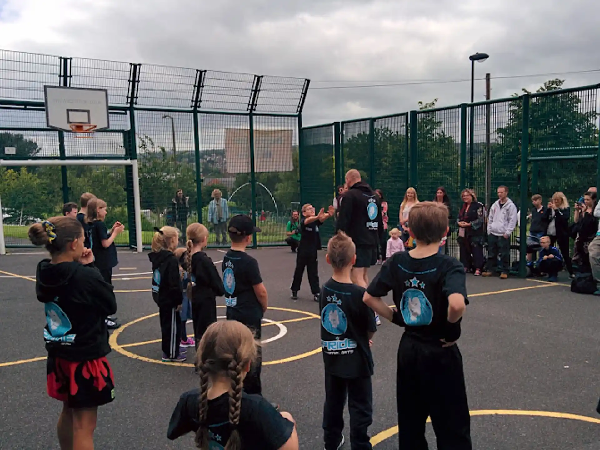 a group of people playing basketball