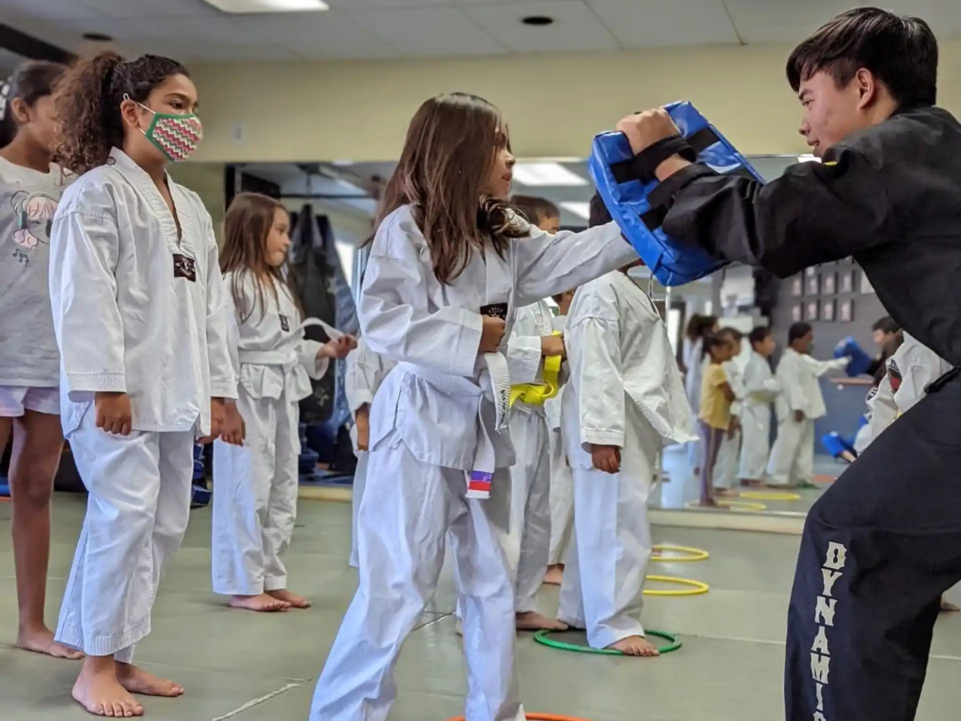 a group of people in karate uniforms