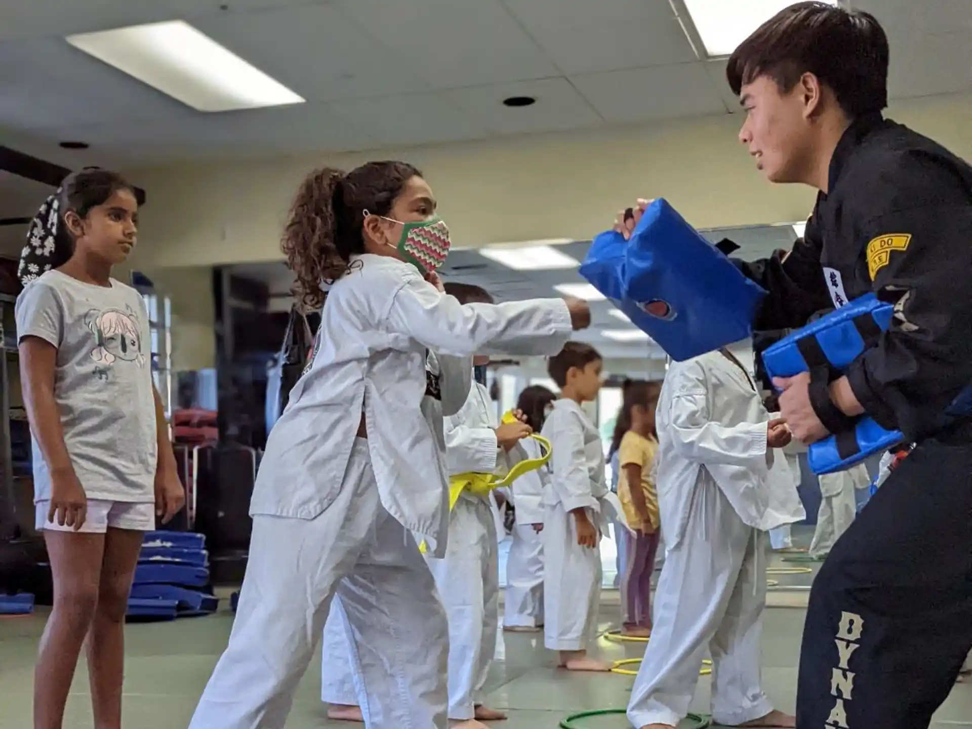 a group of people in karate uniforms