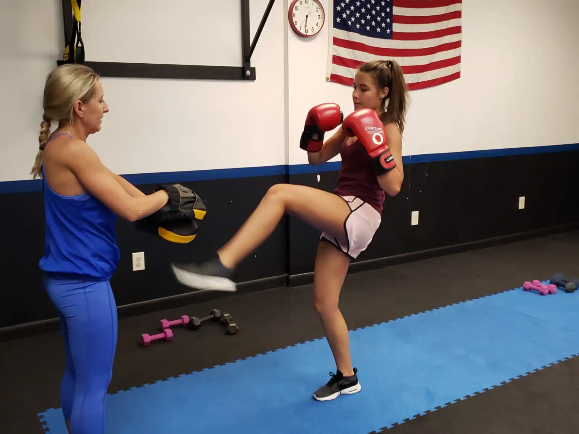 a couple of women in boxing gloves