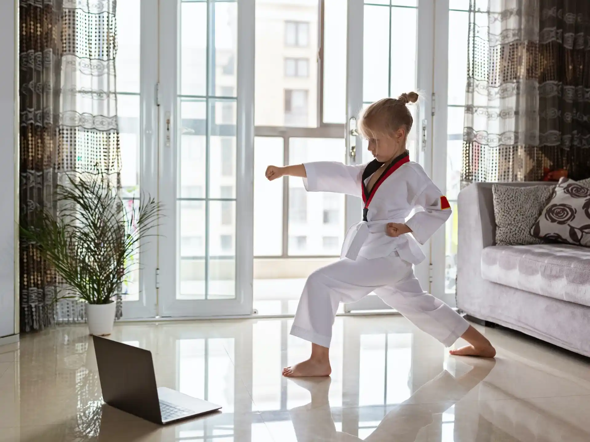 a child in a white uniform