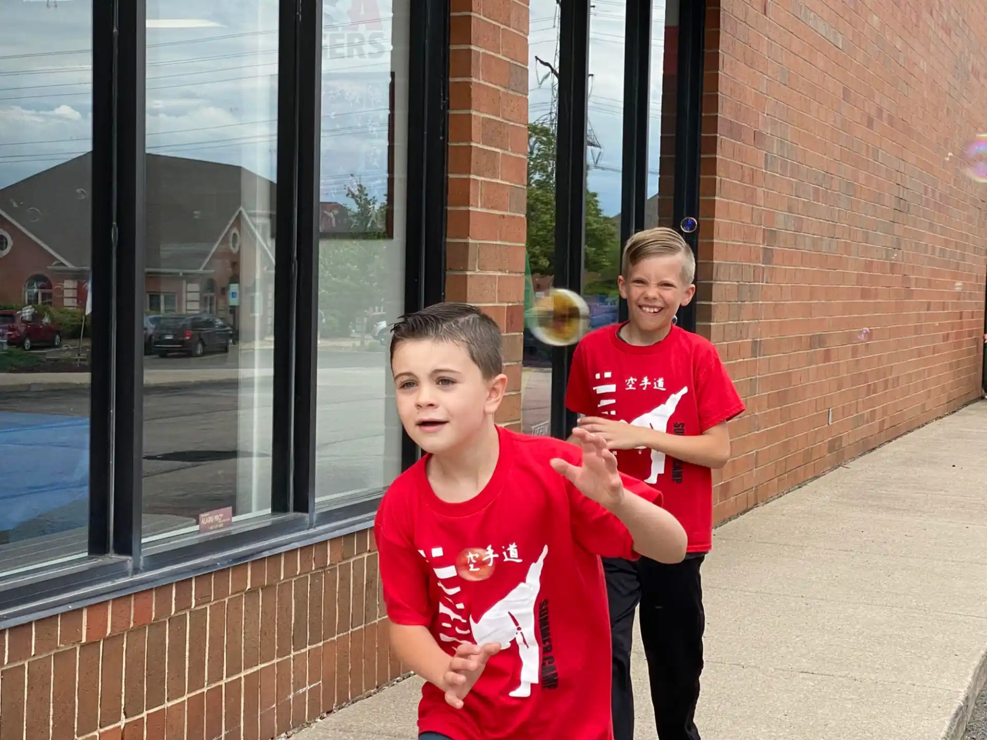 a couple of boys in red shirts