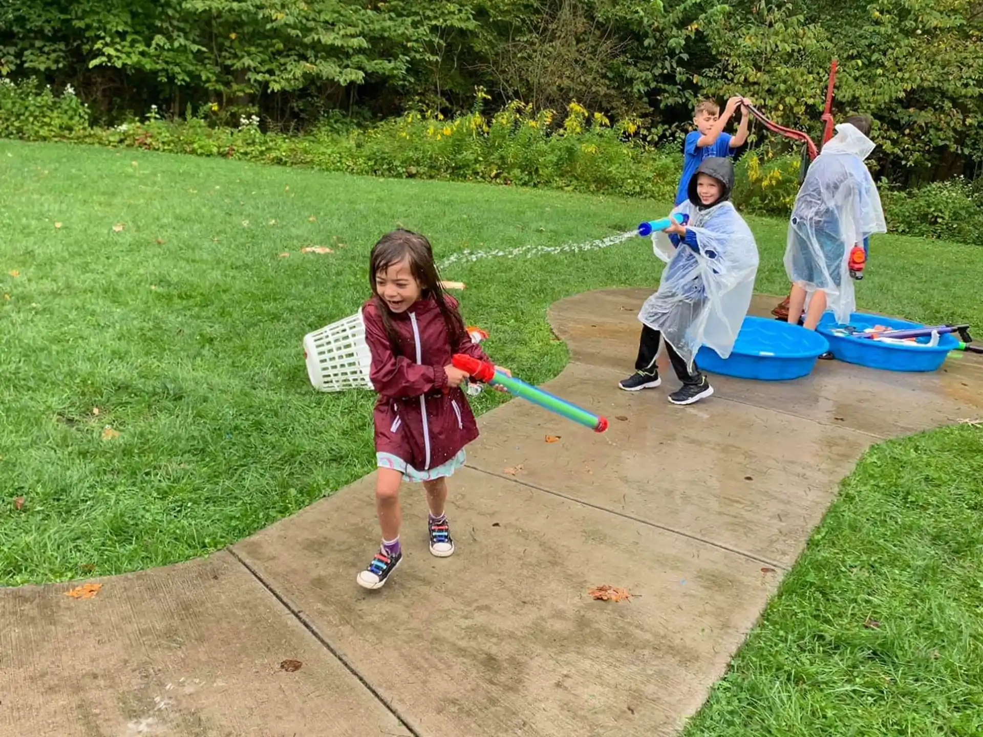a group of kids playing in a yard