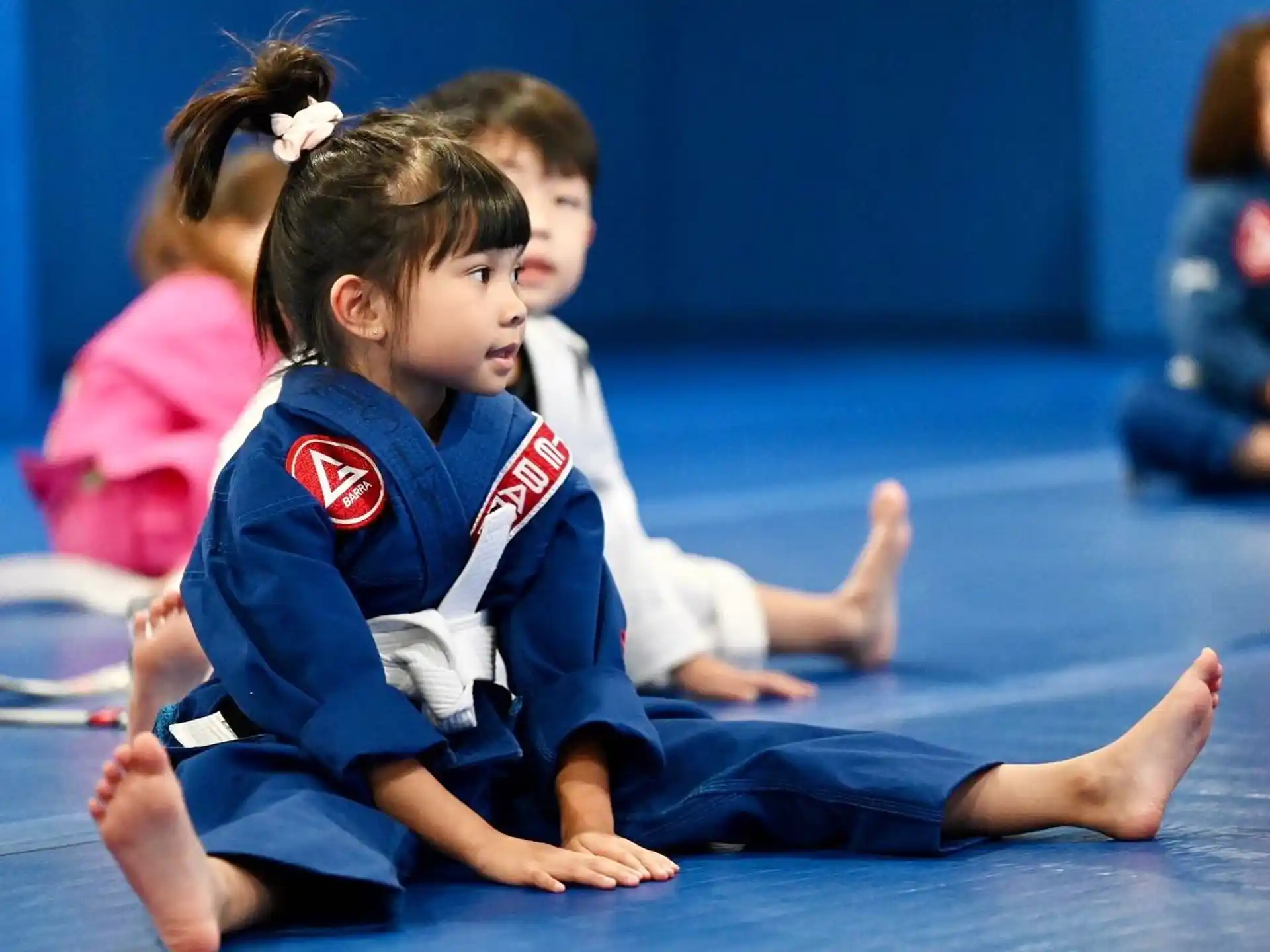 a couple of children sitting on the floor