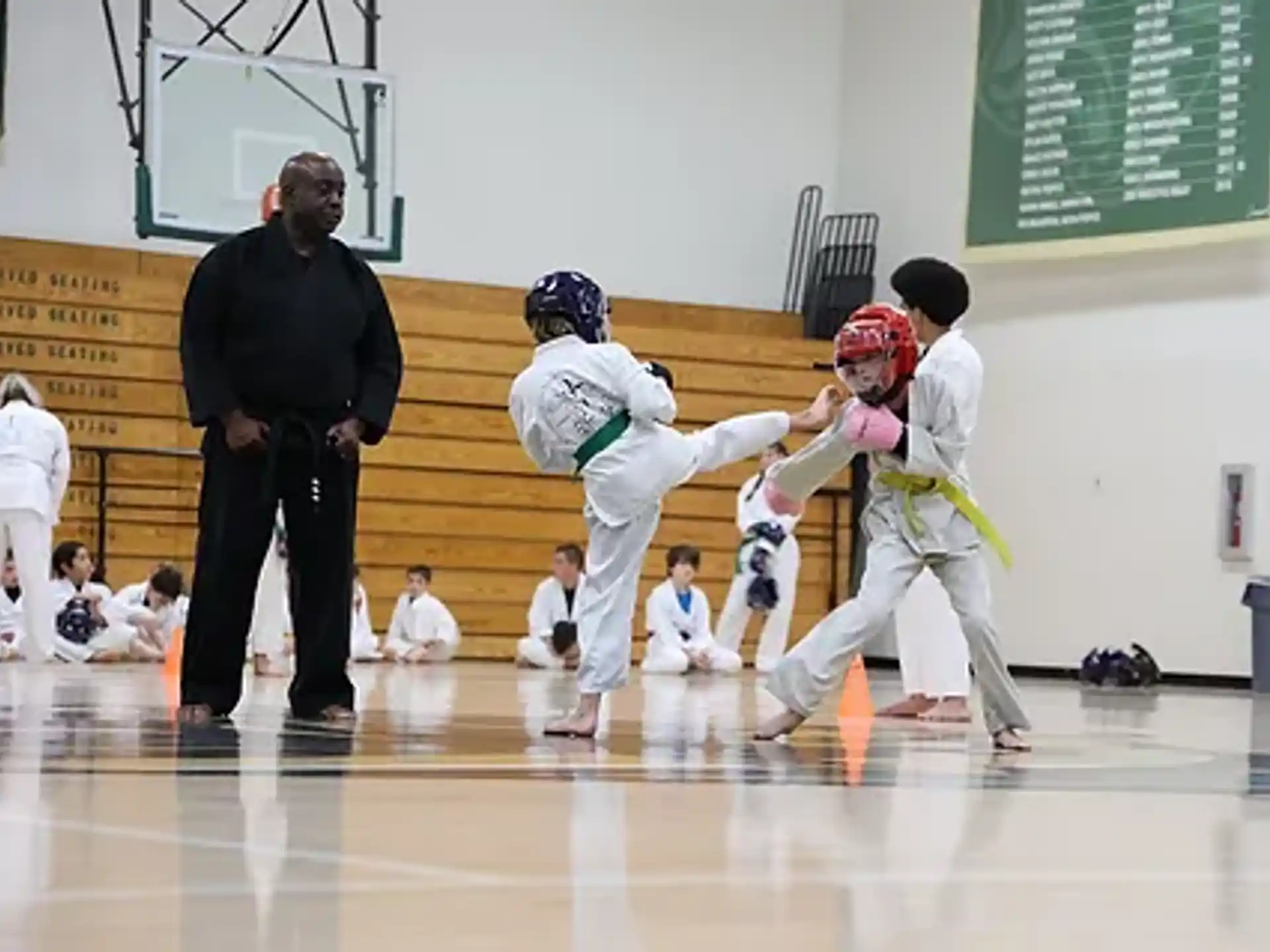 a group of kids in karate uniforms
