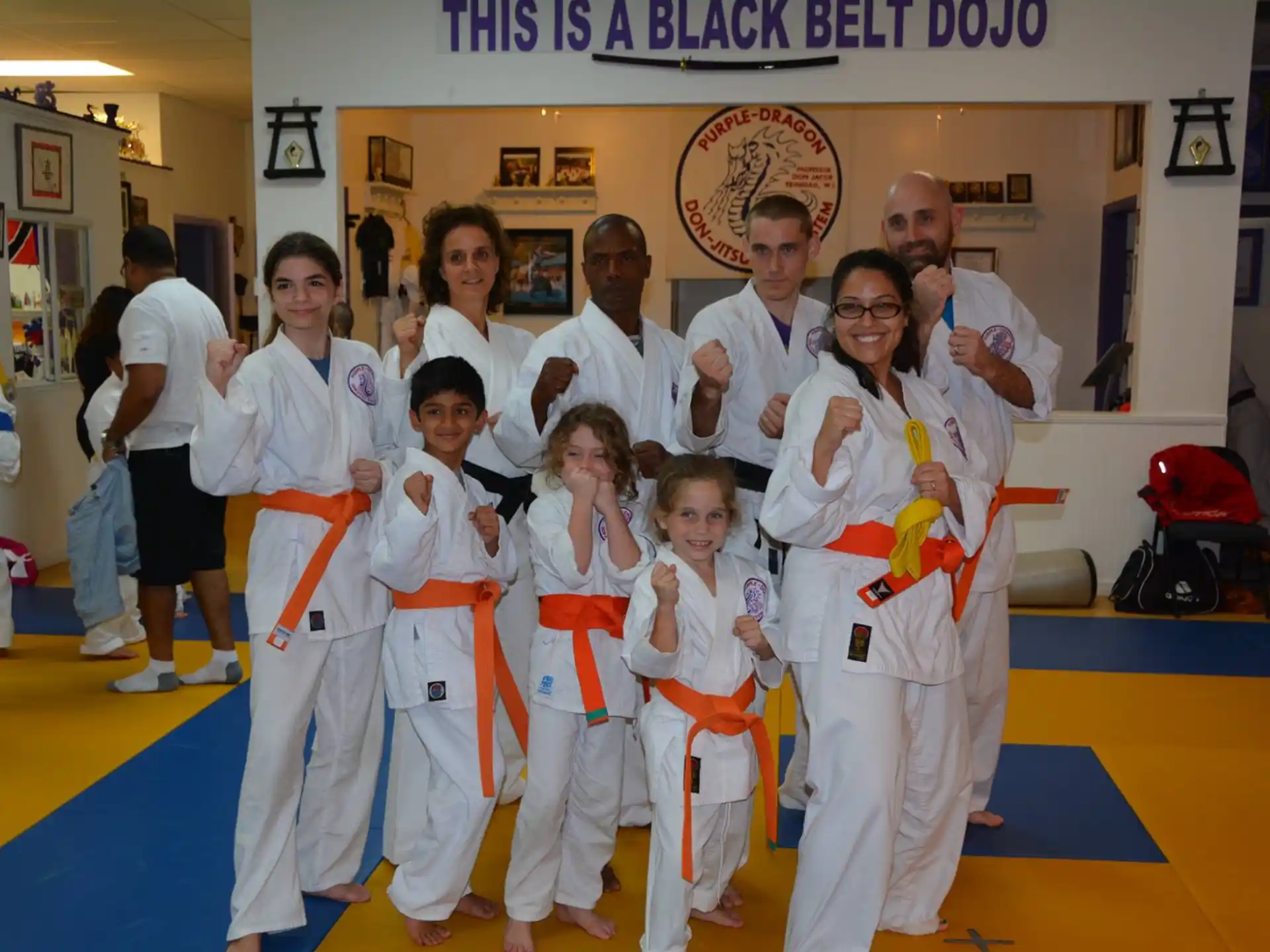 a group of people in karate uniforms