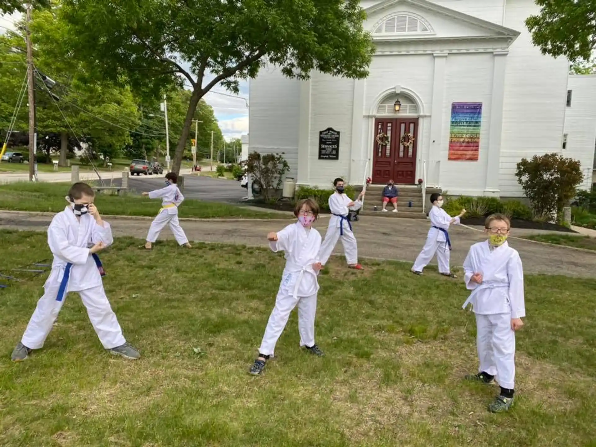 a group of children in karate uniforms