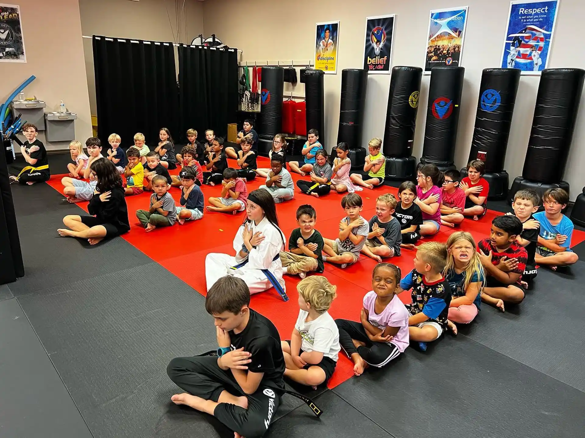 a group of children sitting on the floor