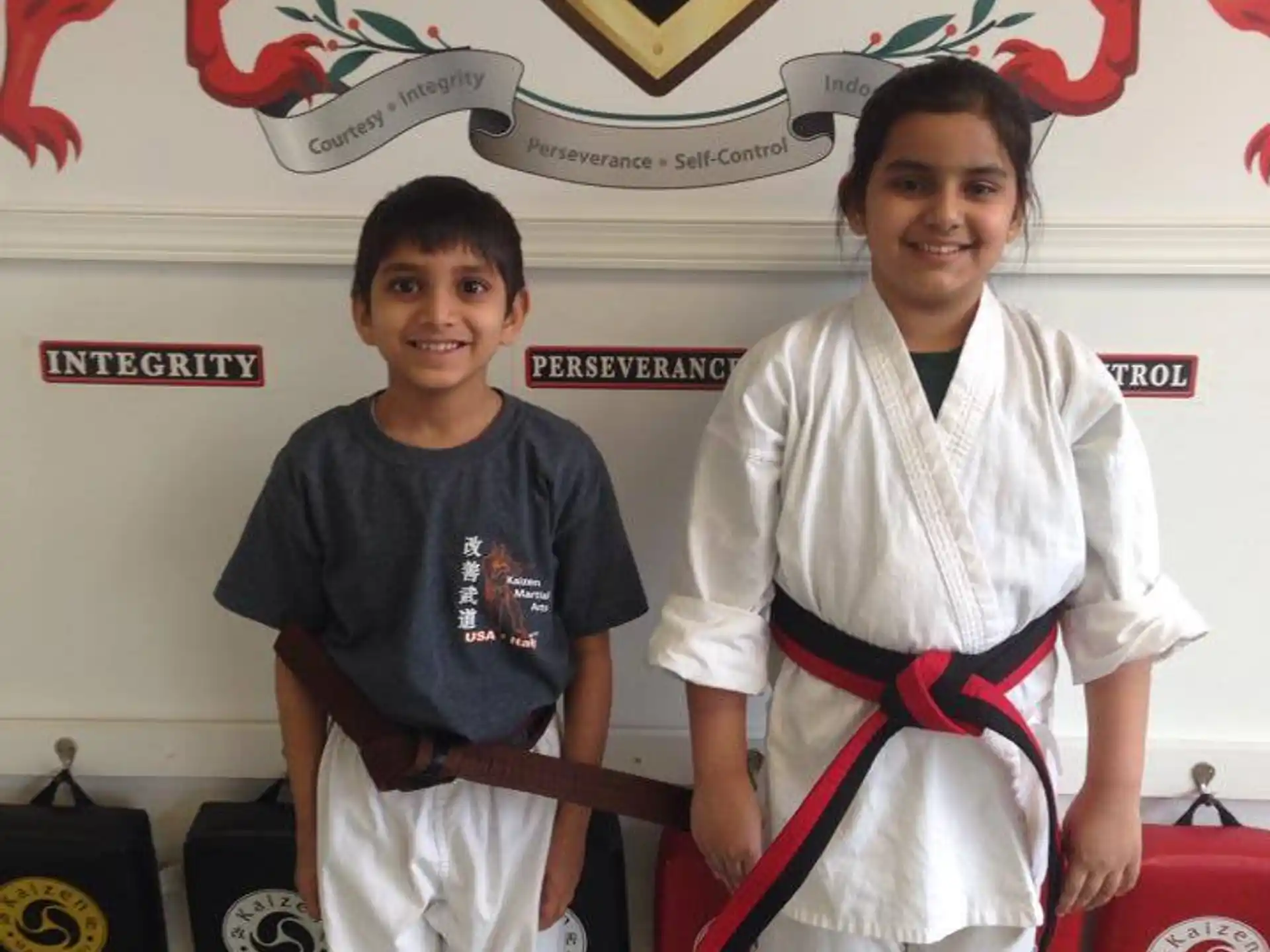 a boy and girl posing for a picture