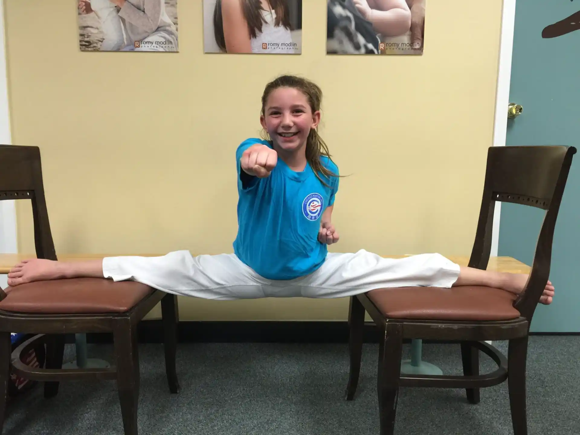 a girl sitting on a chair