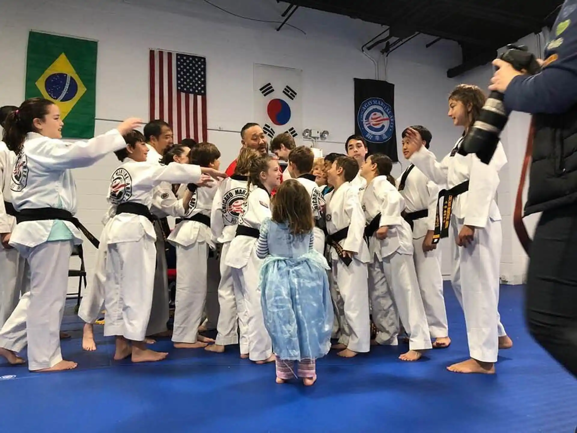 a group of people in karate uniforms