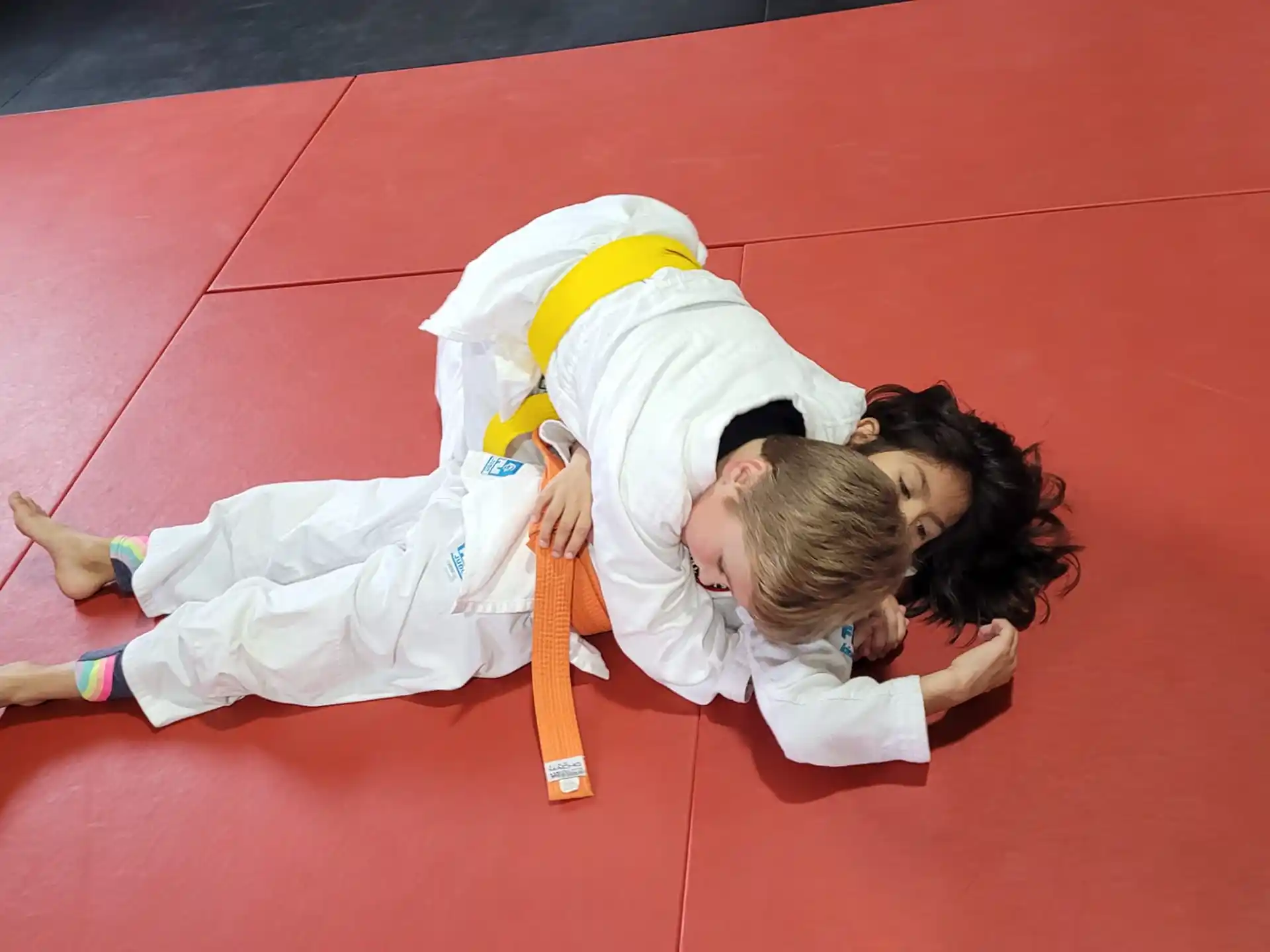 a couple of people in karate uniforms