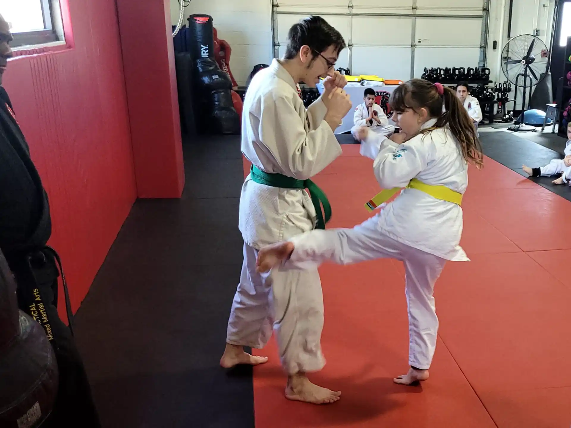a man and a woman in karate uniforms