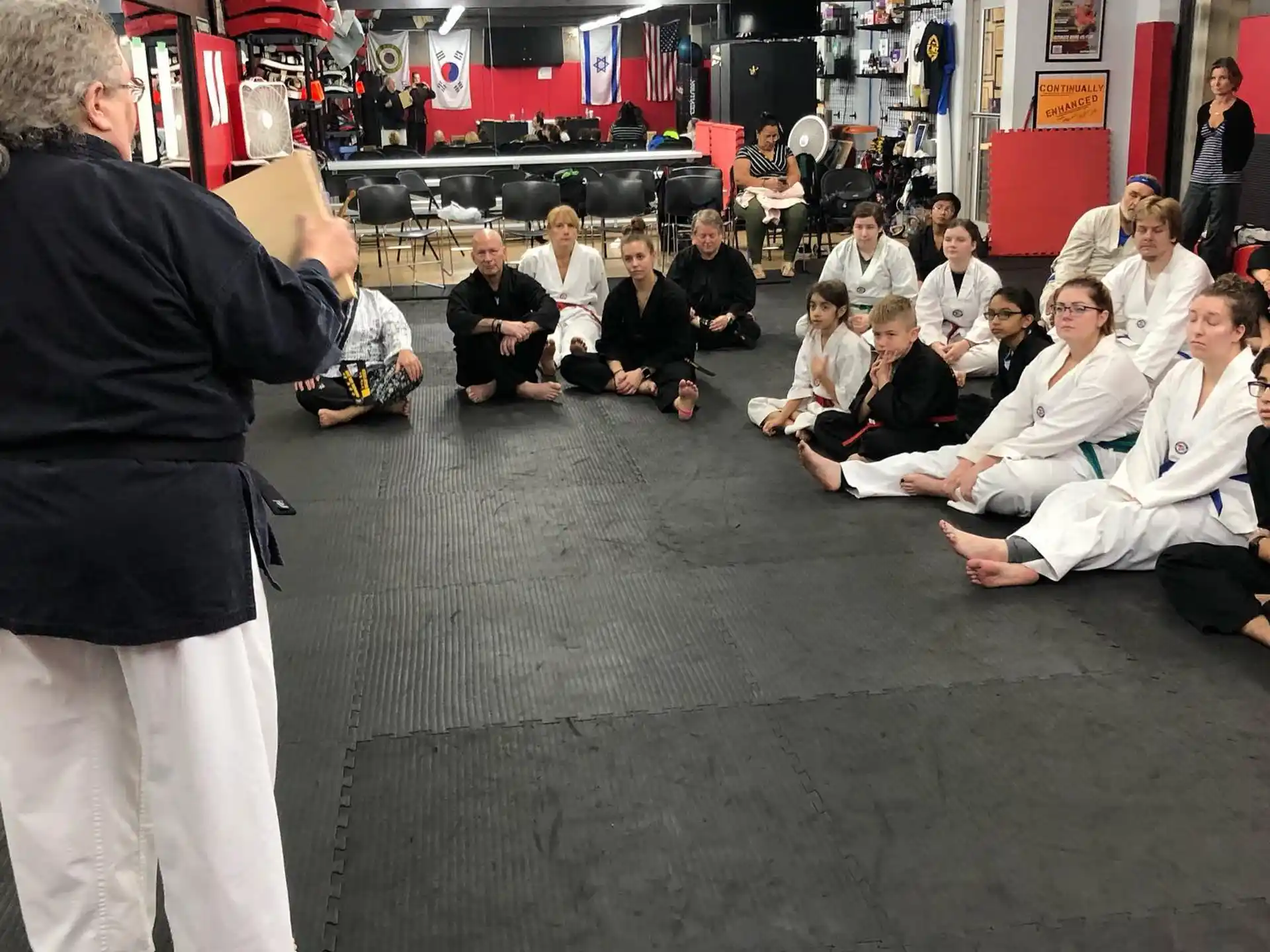a group of people sitting on the floor