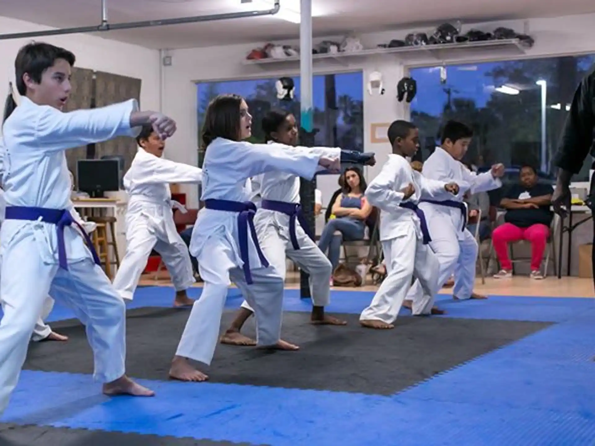 a group of people in karate uniforms
