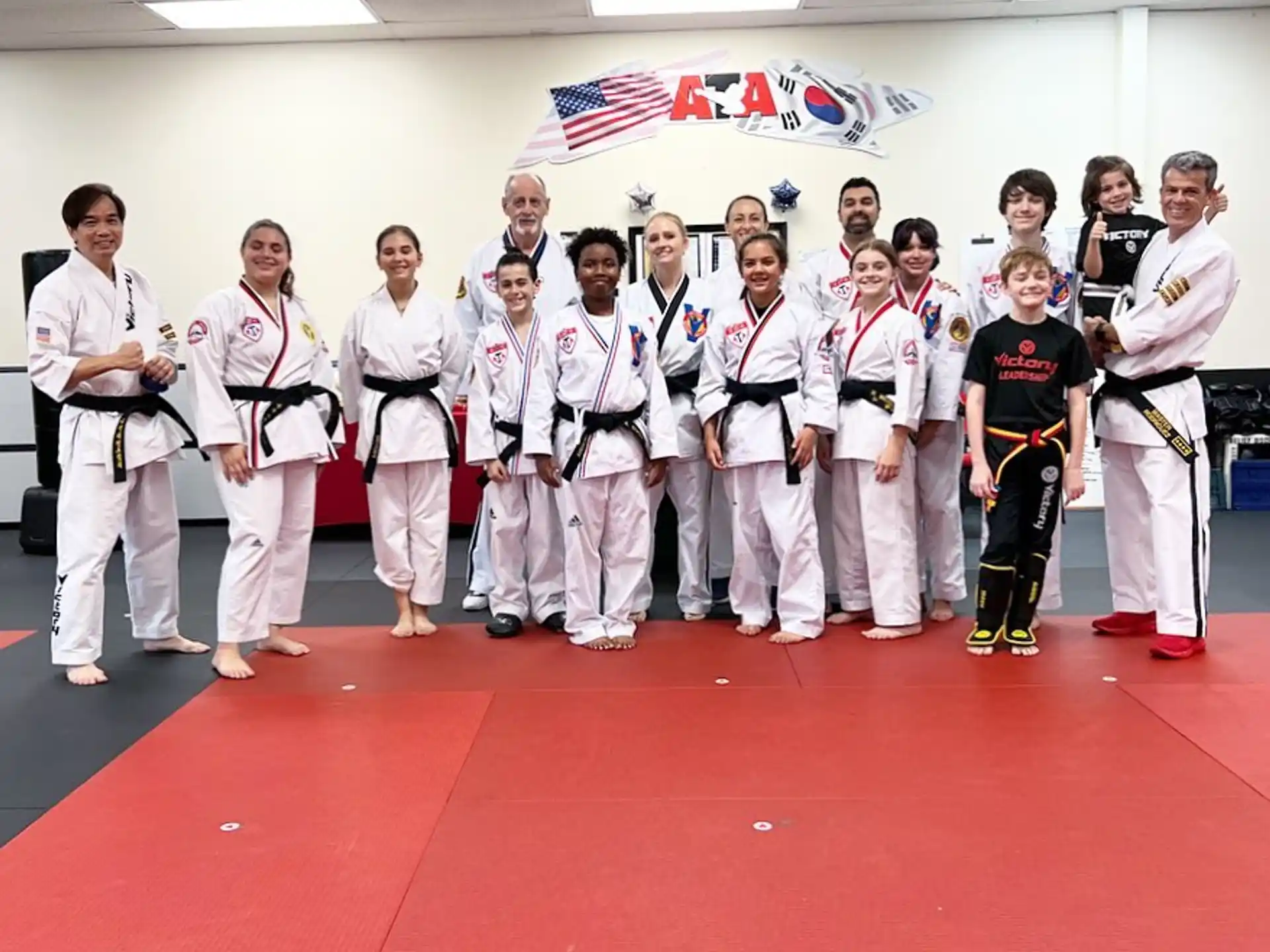 a group of people in karate uniforms