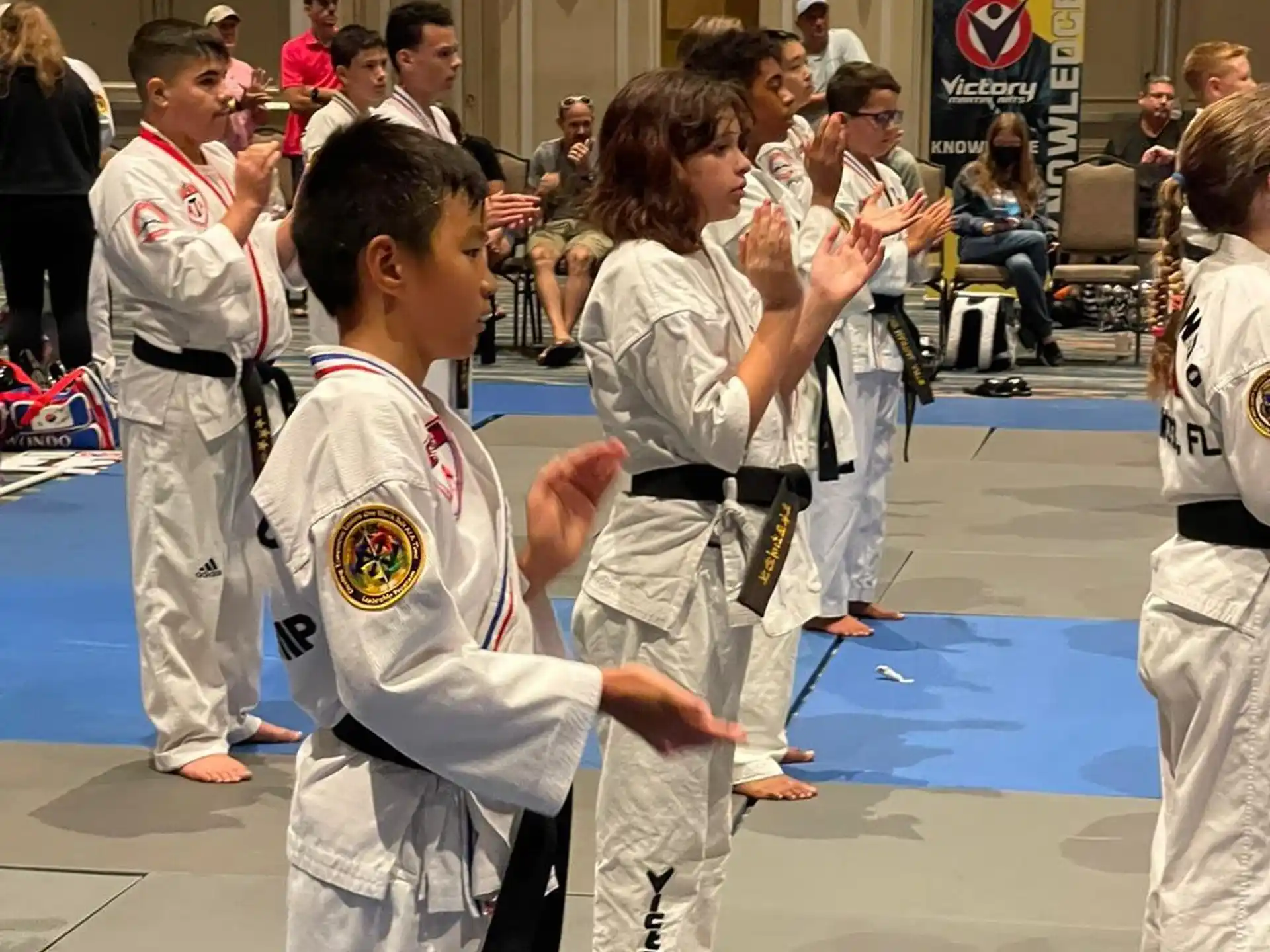 a group of people in karate uniforms