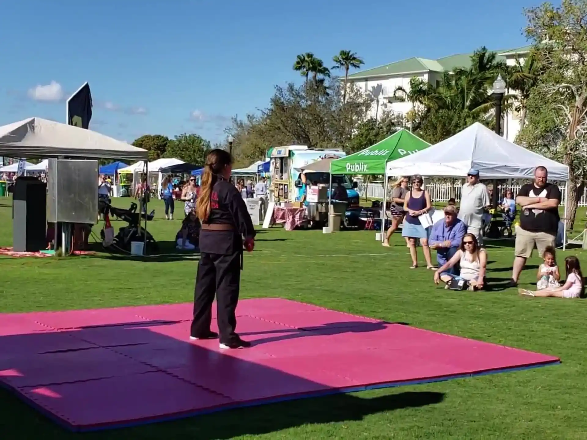 a person standing on a colorful mat