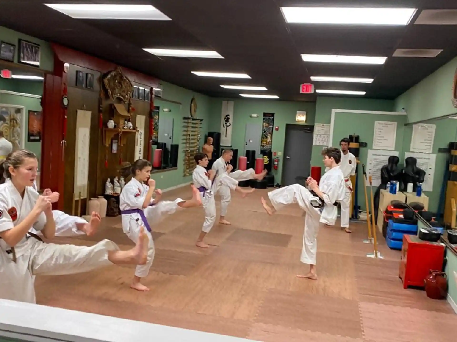 a group of people in karate uniforms