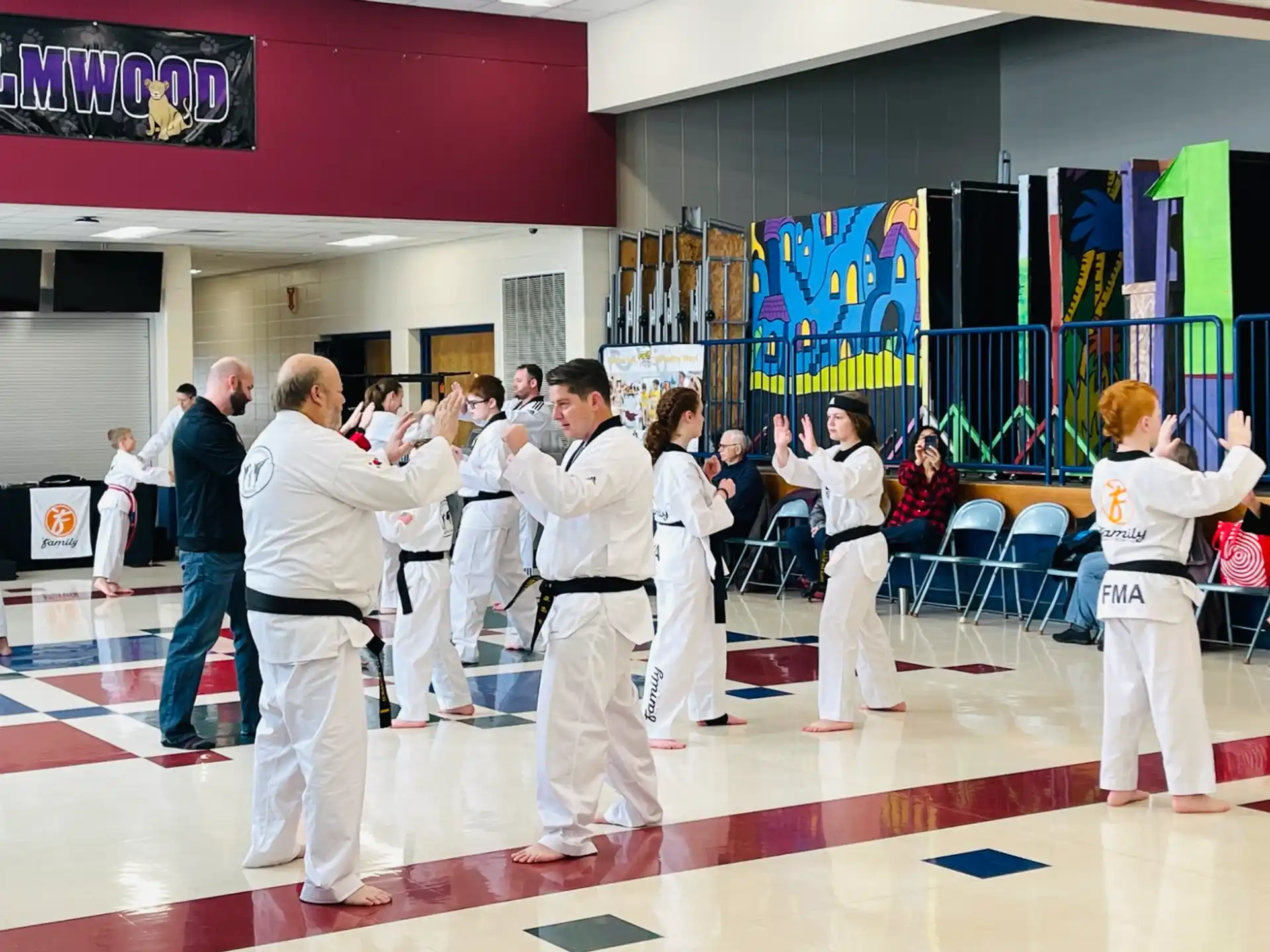 a group of people in karate uniforms