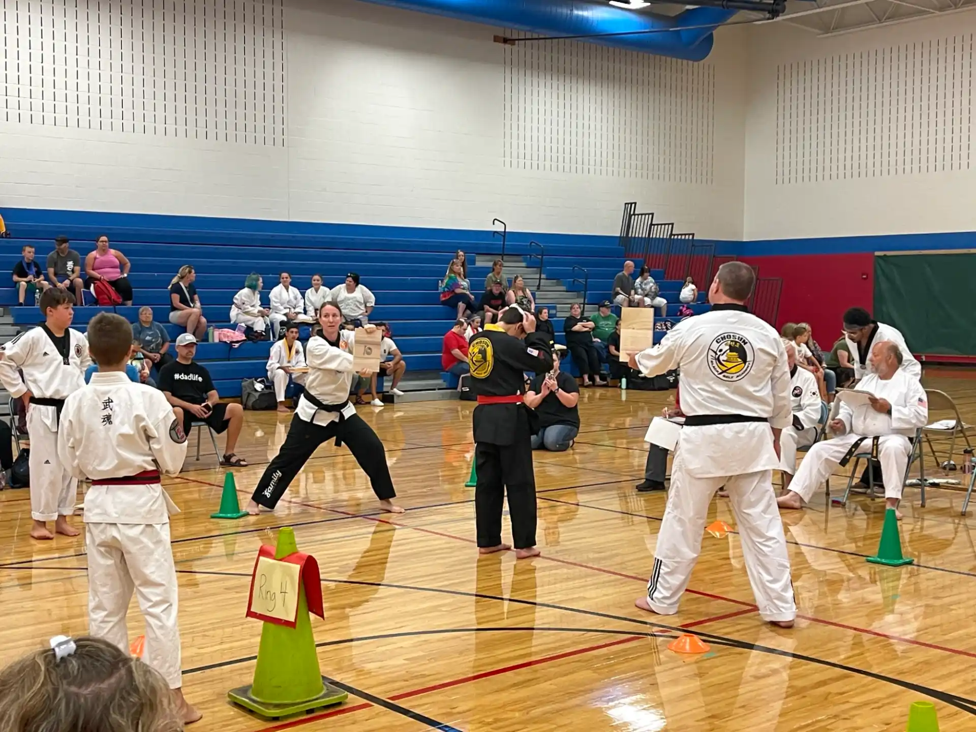a group of people in karate uniforms