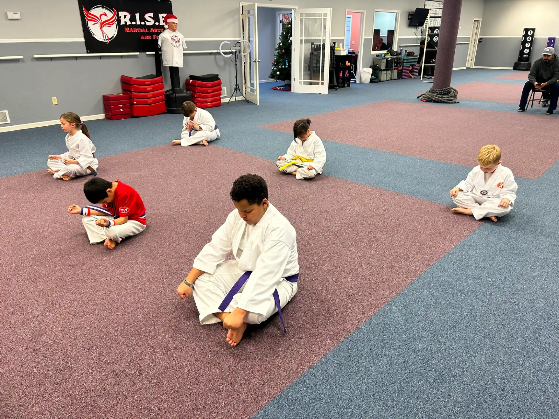 a group of people sitting on the floor