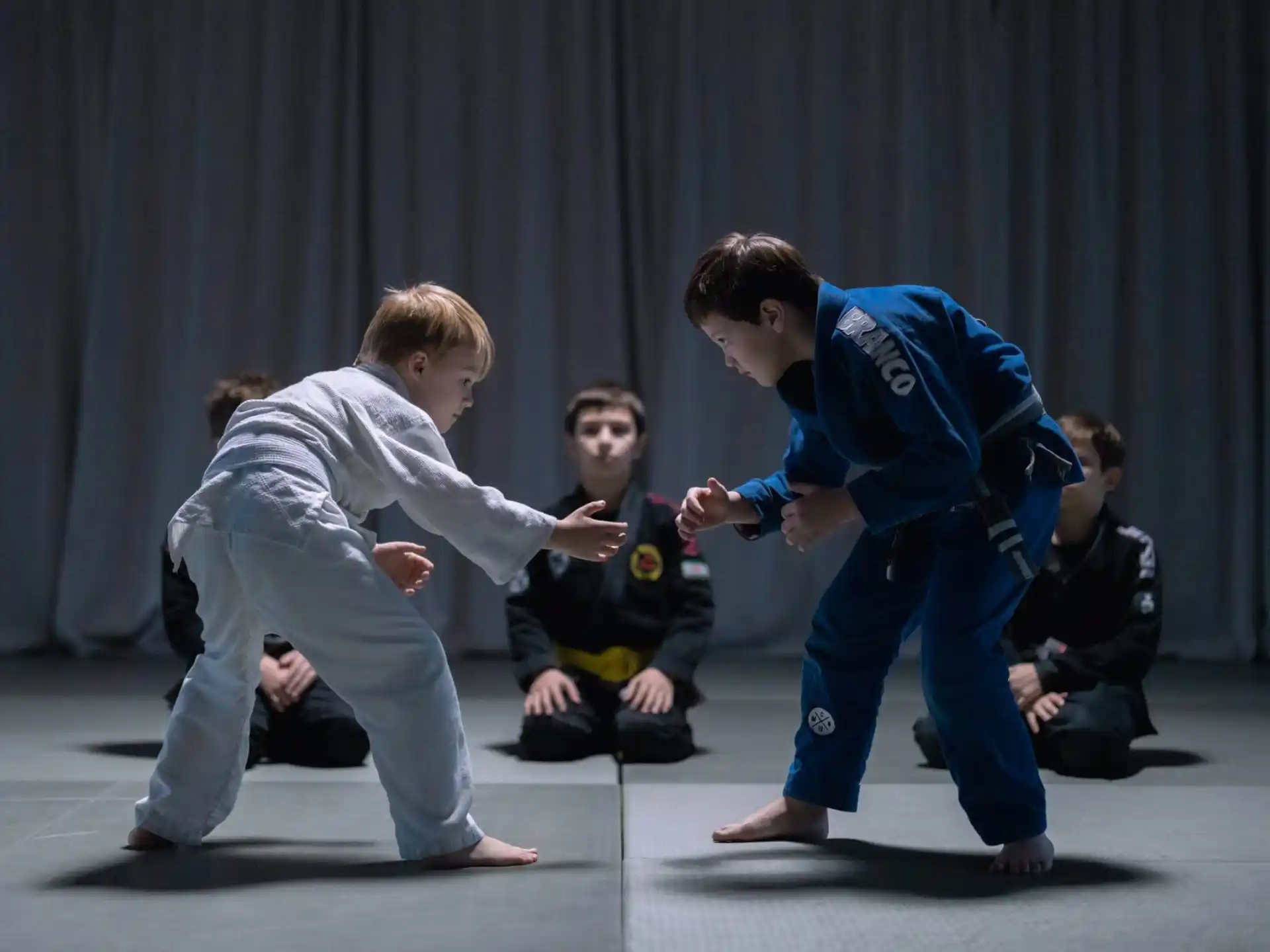 a group of people in karate uniforms